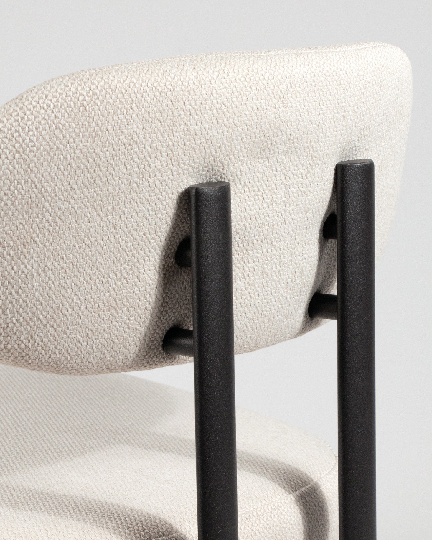 Durban chair with mother-of-pearl upholstery and black metal legs