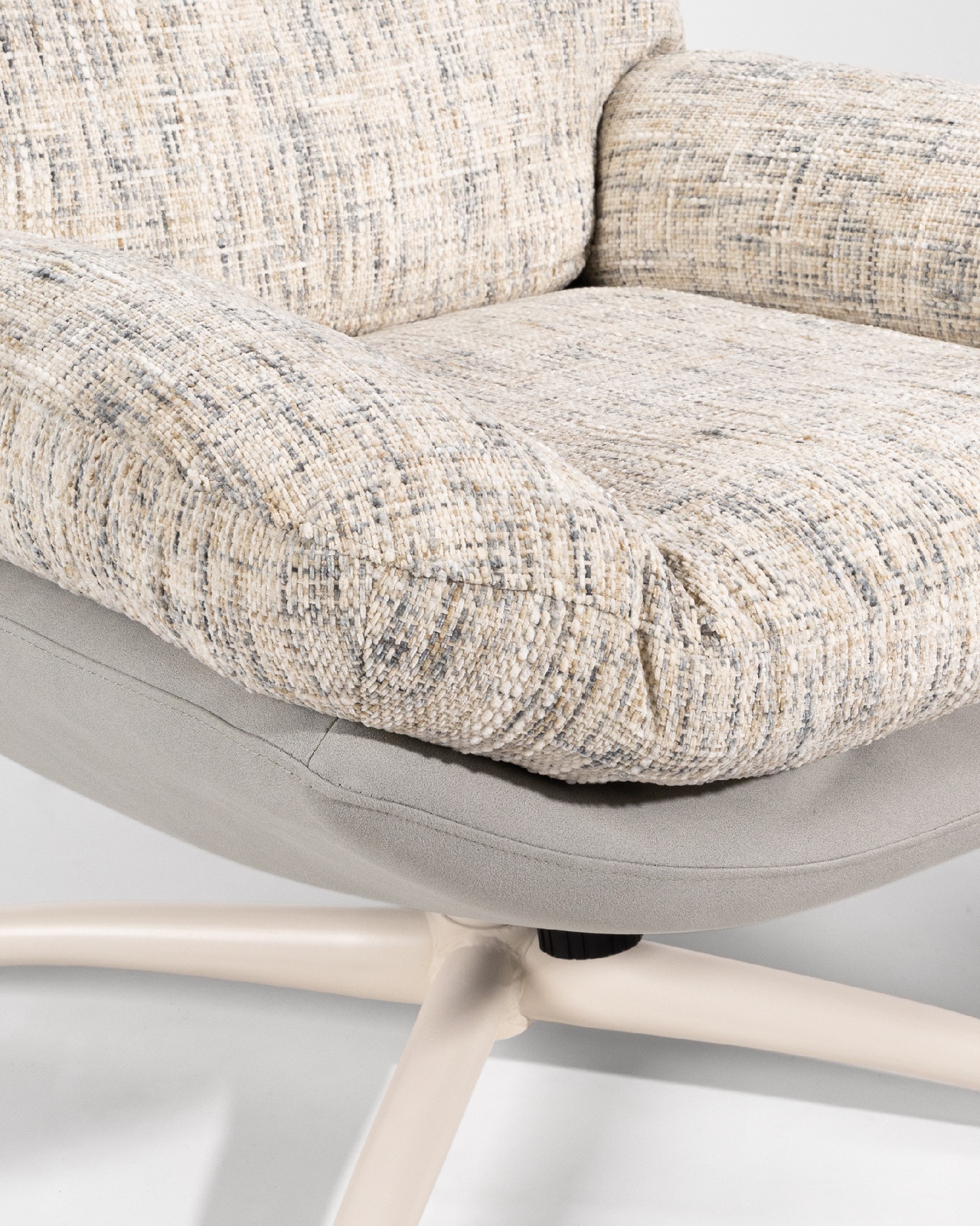 Fresia armchair with pearl and cloud upholstery and ivory metal structure ottoman, 360° rotating tilting.