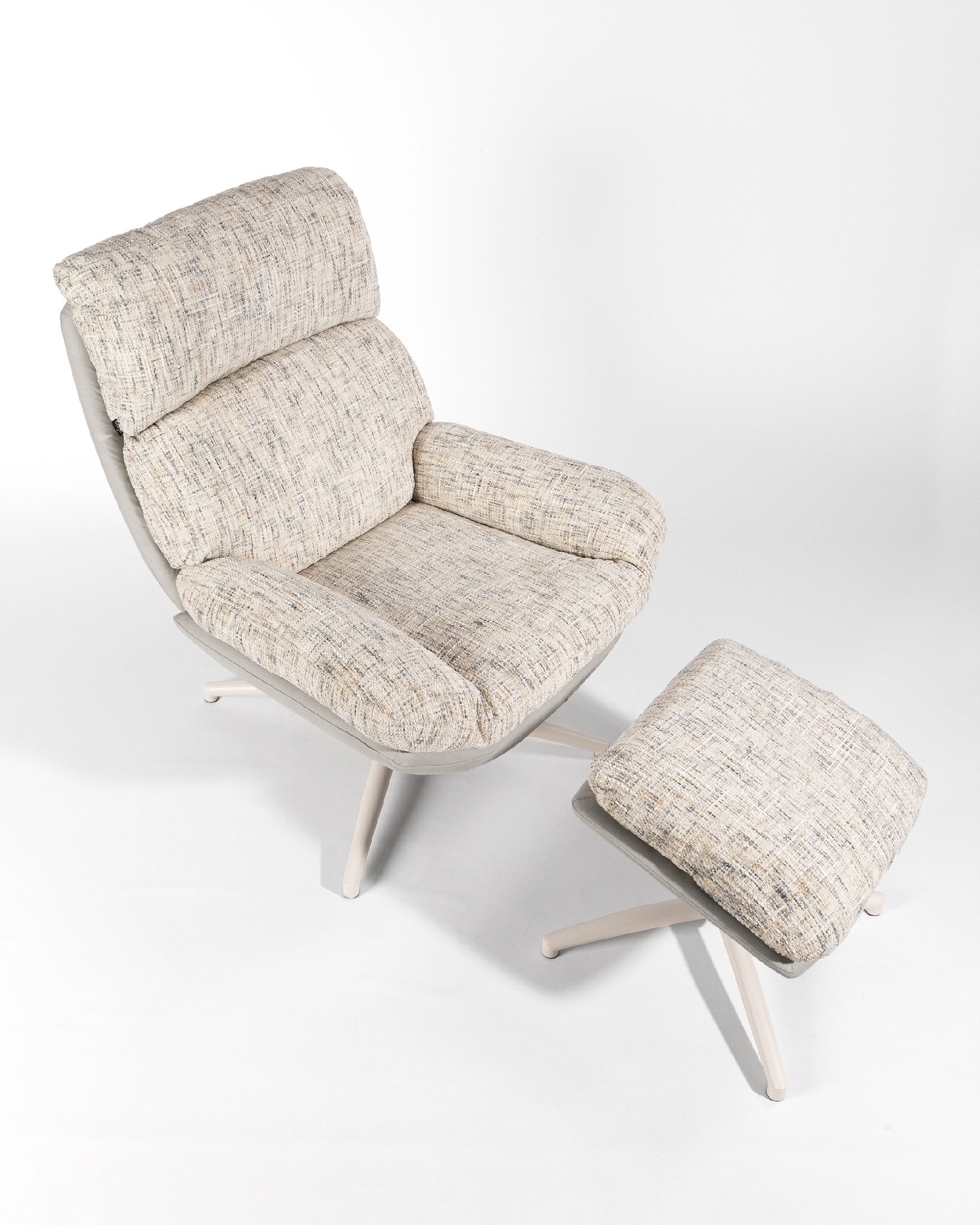 Fresia armchair with pearl and cloud upholstery and ivory metal structure ottoman, 360° rotating tilting.
