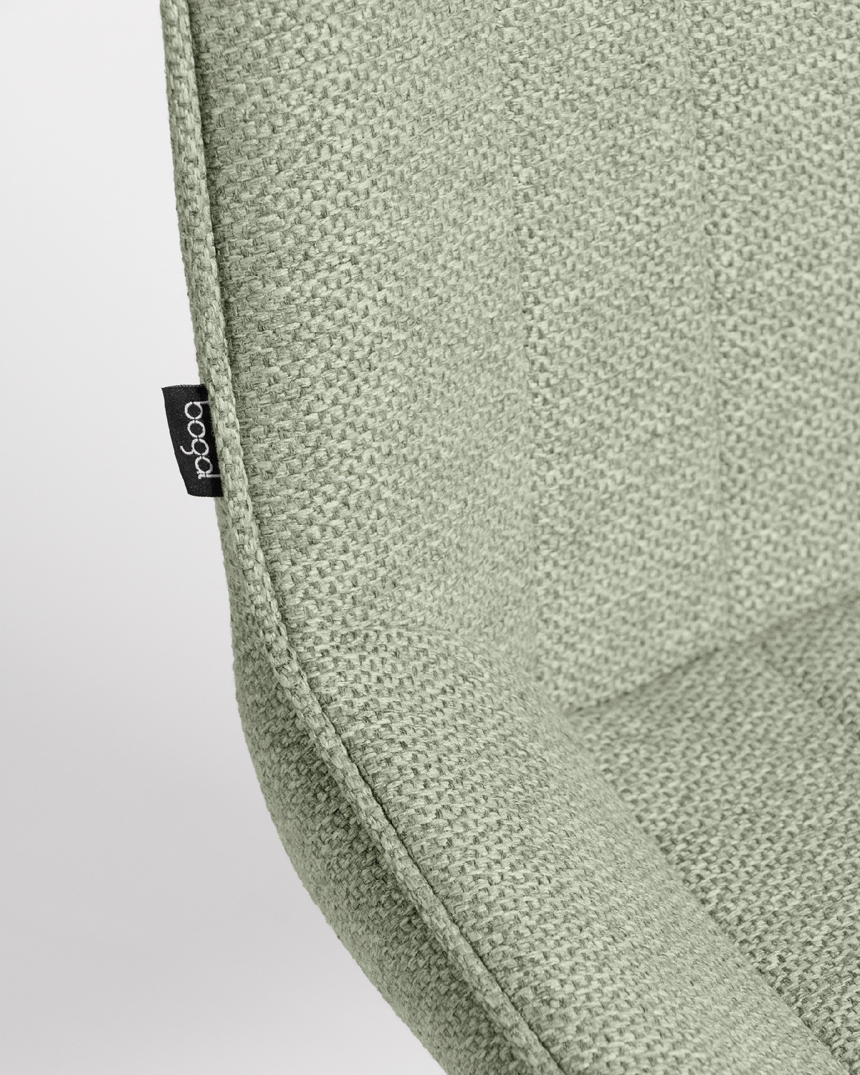 Chaise Helsinki avec un revêtement vert et des pieds métalliques ivoire