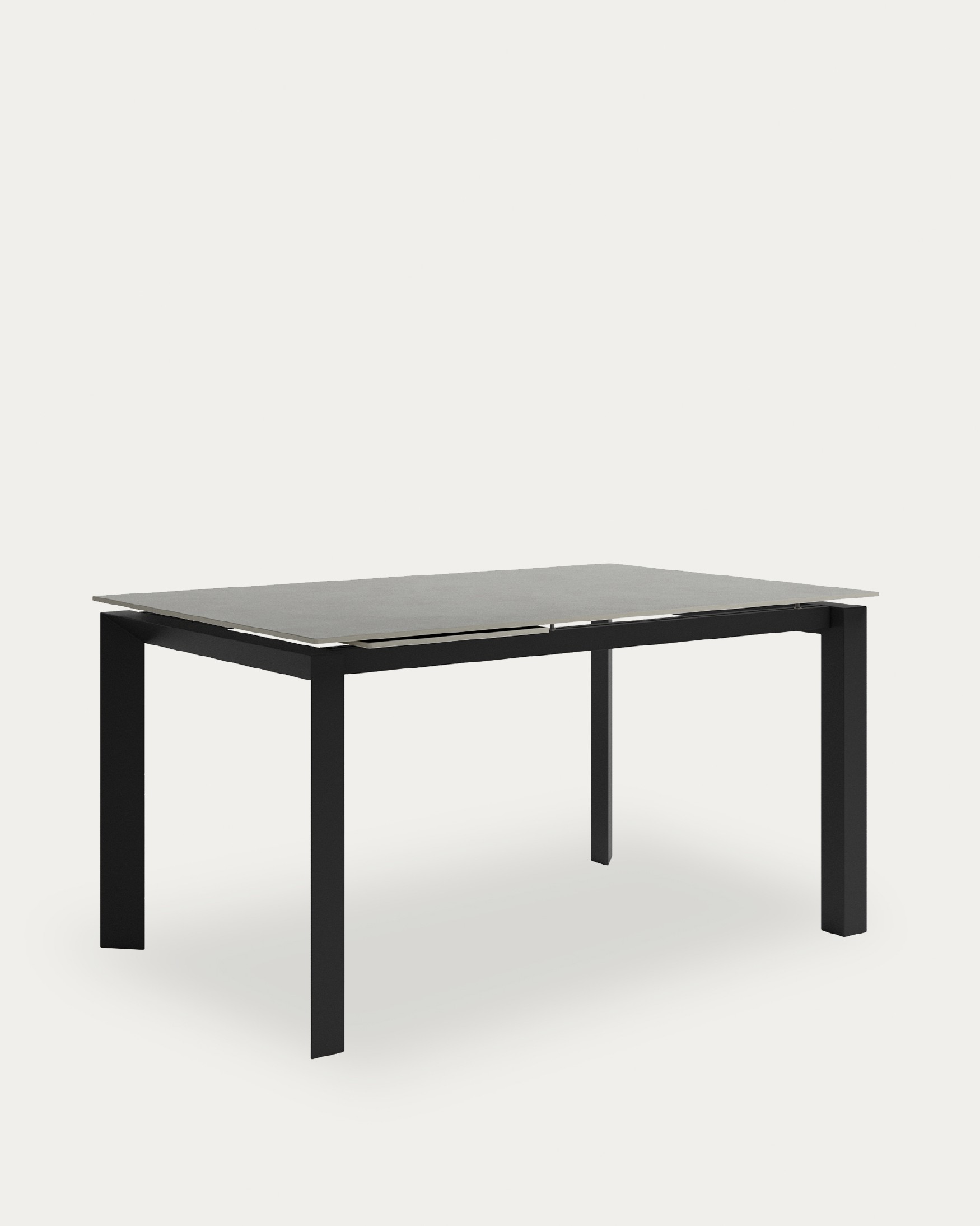 Table Júcar extensible avec finition porcelaine porland et structure métallique noire 180-230 x 90 cm