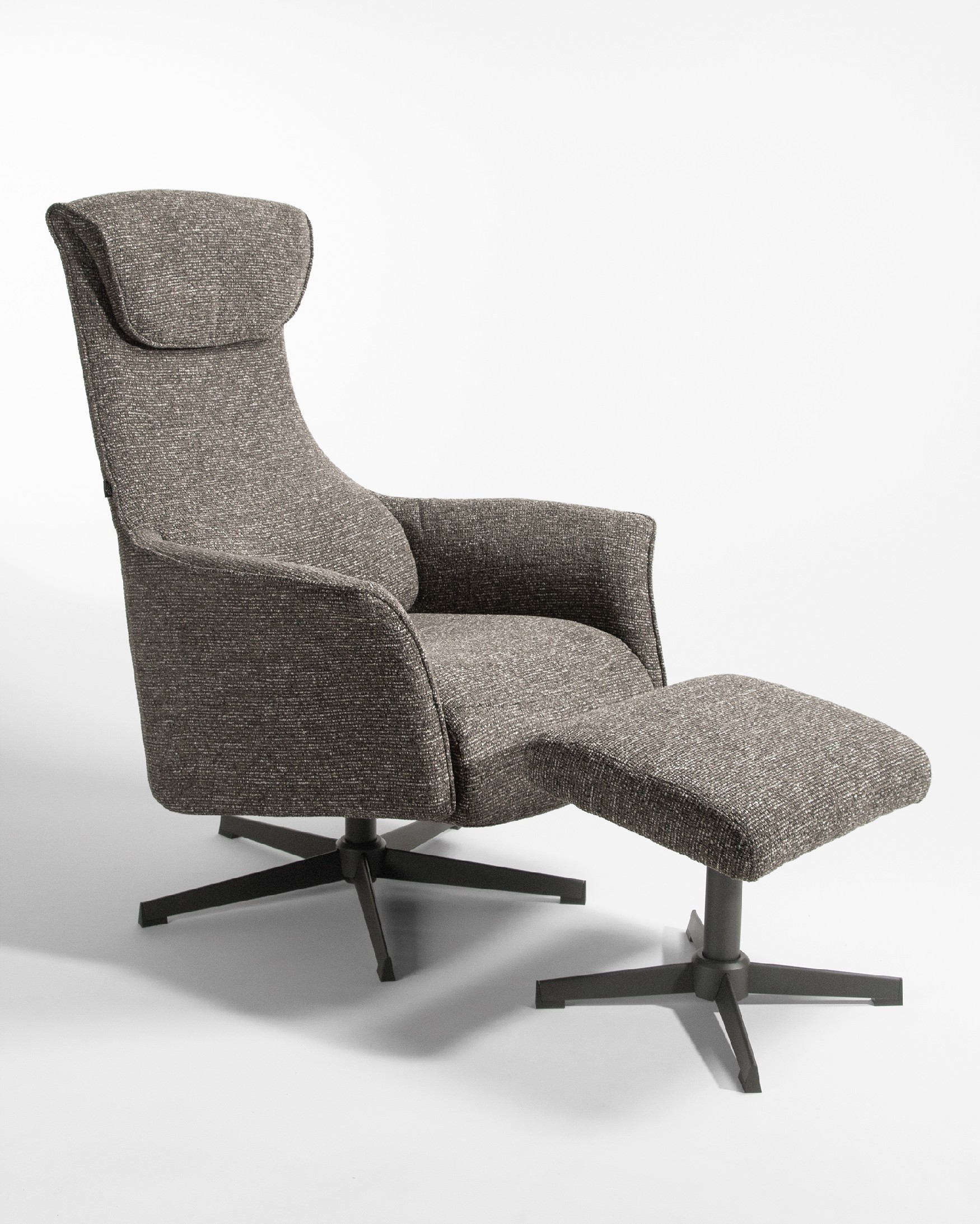 Kiara manual swivel recliner with anthracite upholstery and black metal leg. With ottoman.