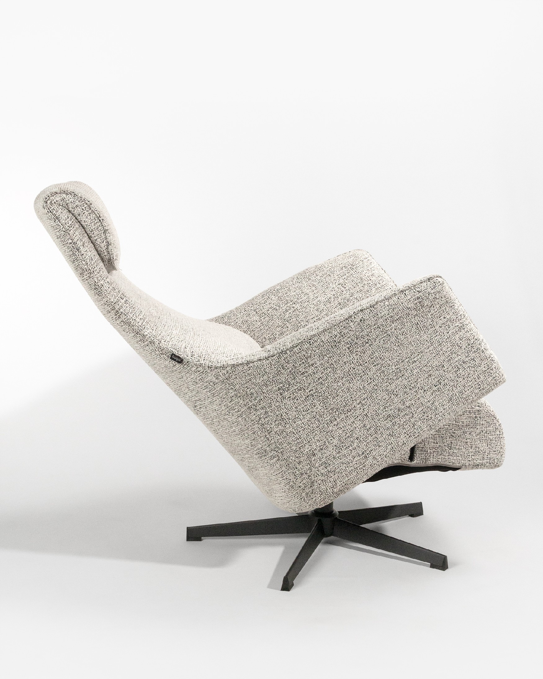 Kiara manual rotating relax armchair with speckled upholstery and black metal leg. With ottoman.