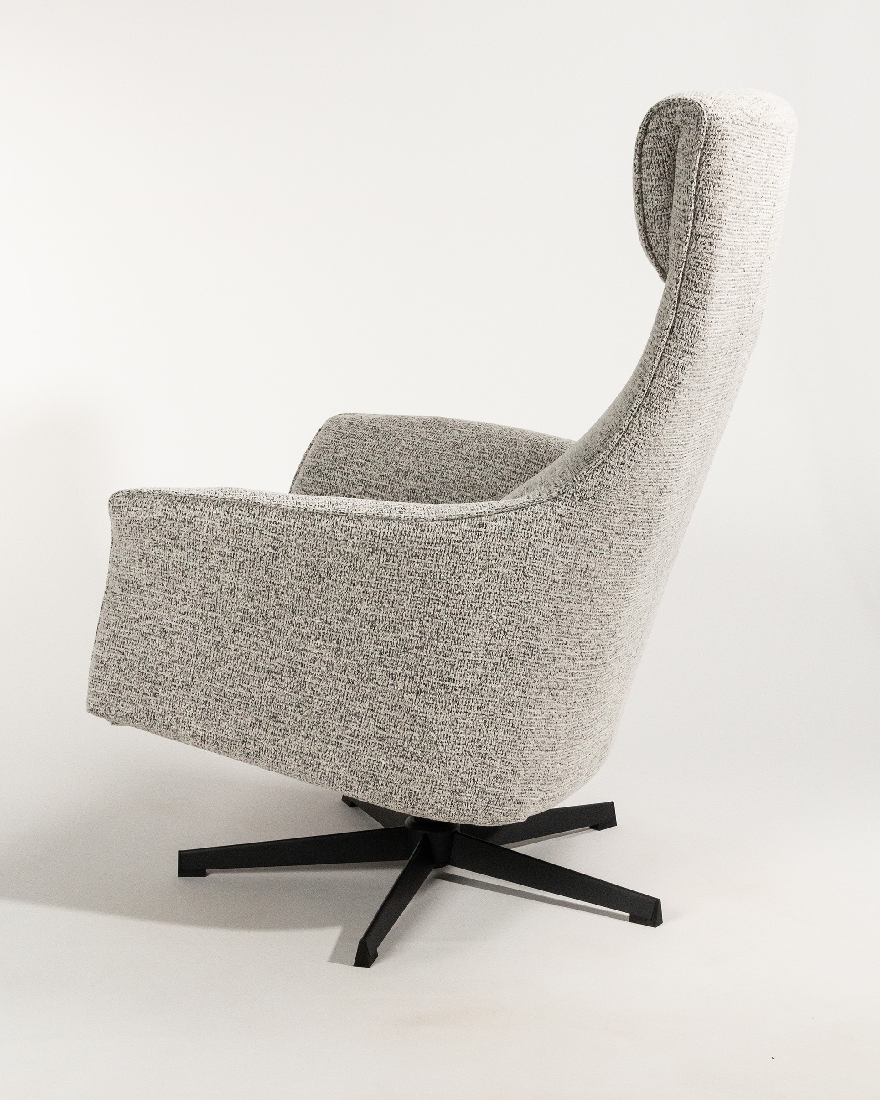 Kiara manual rotating relax armchair with speckled upholstery and black metal leg. With ottoman.