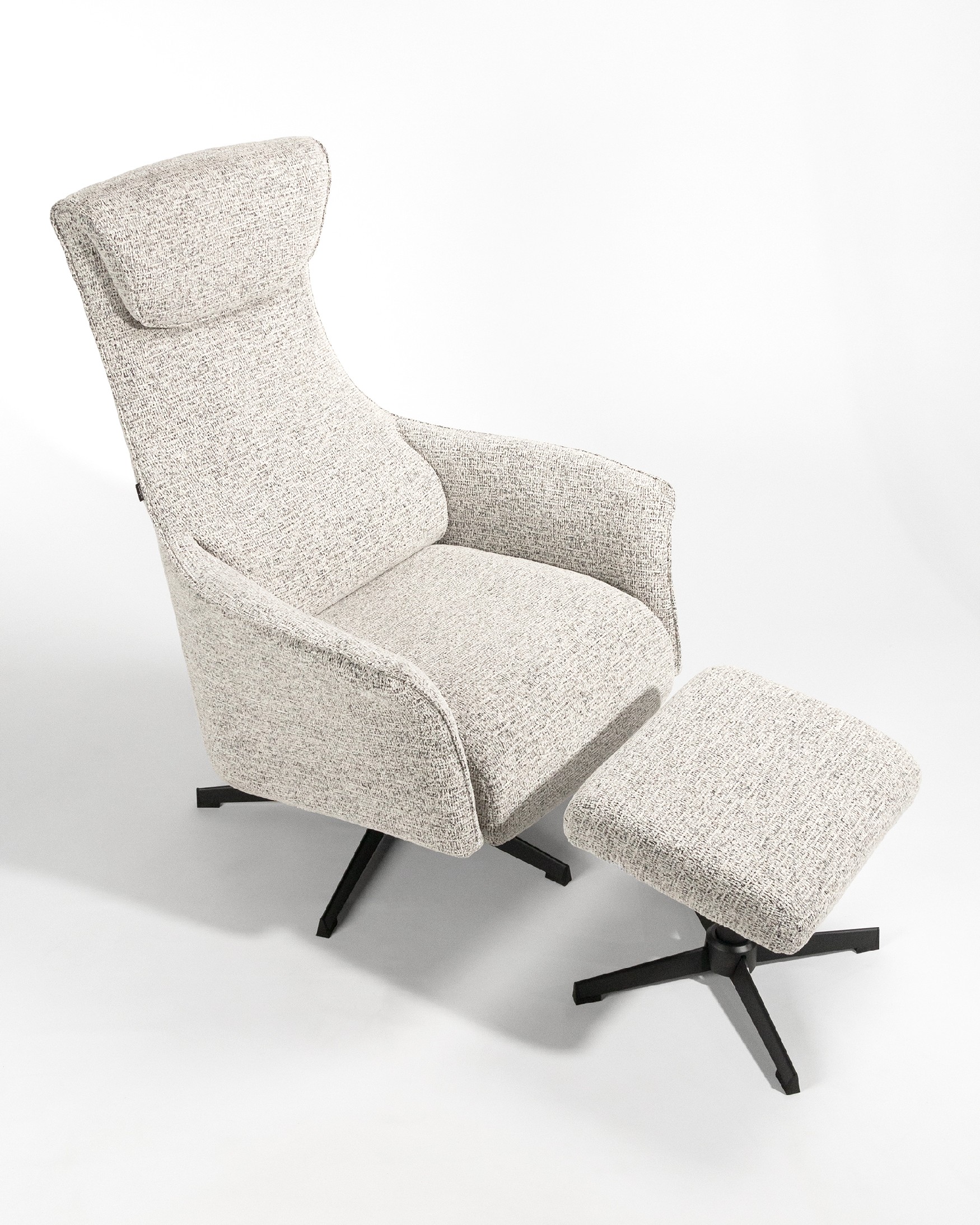 Kiara manual rotating relax armchair with speckled upholstery and black metal leg. With ottoman.