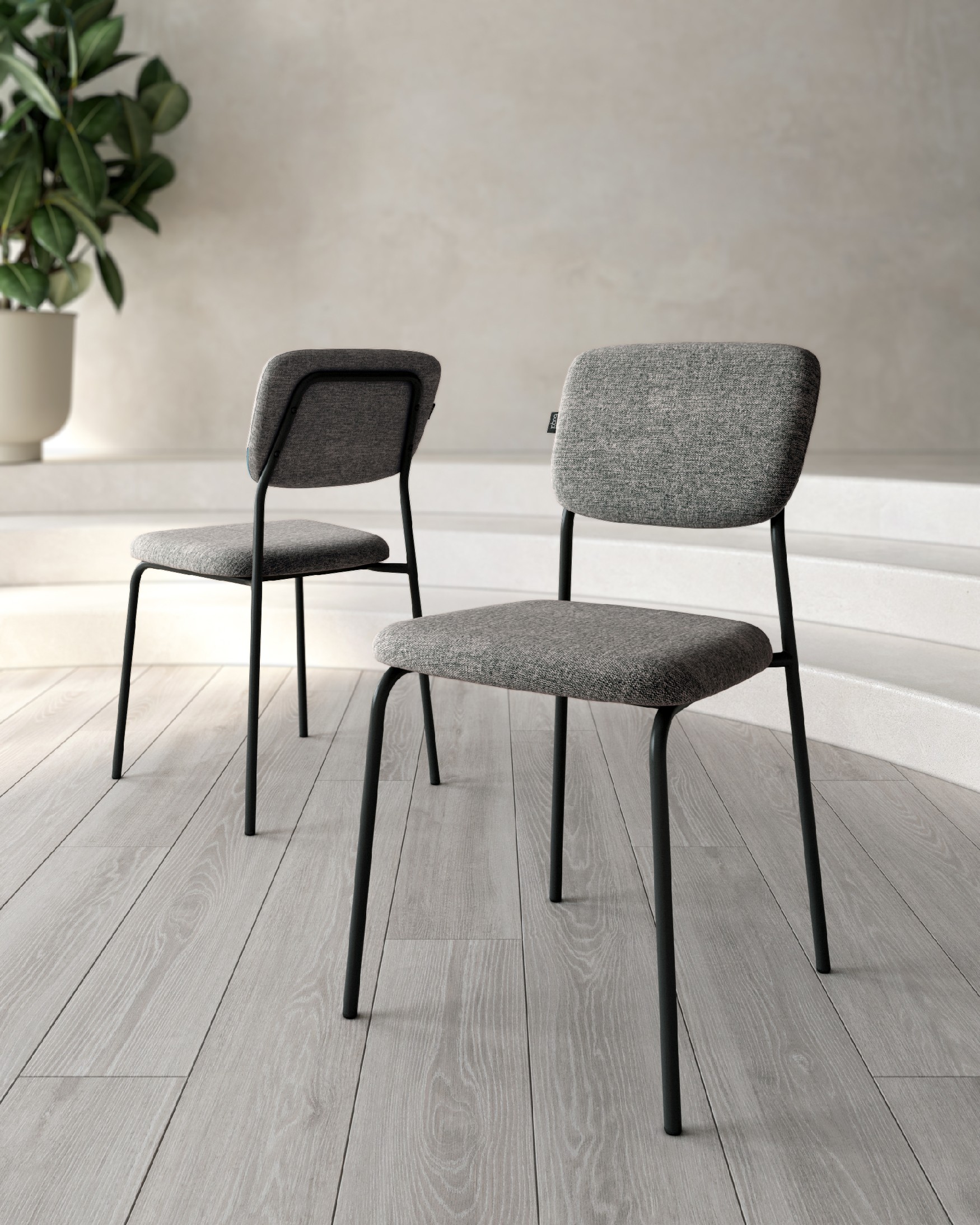 Kobe chair with gray upholstery and black metal legs