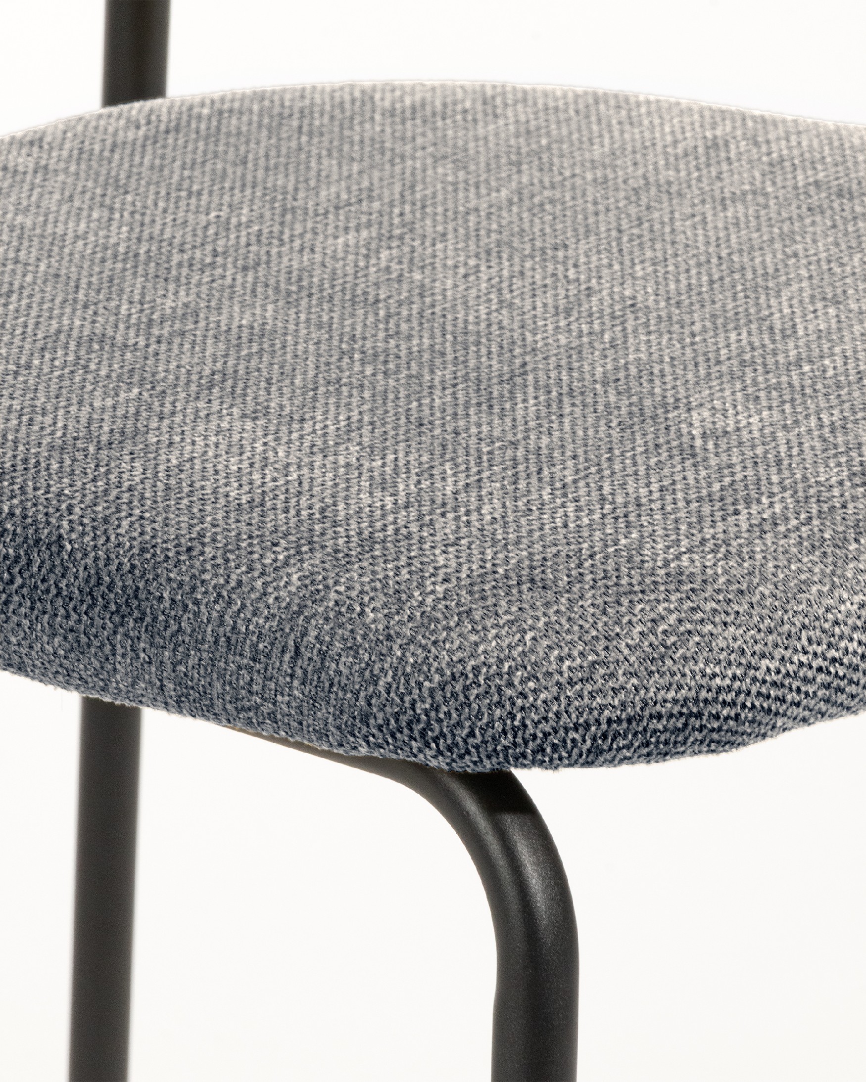 Kobe chair with gray upholstery and black metal legs