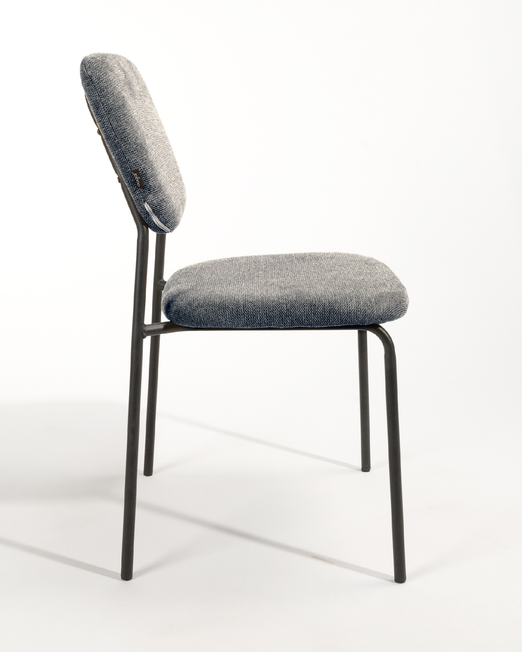 Kobe chair with gray upholstery and black metal legs