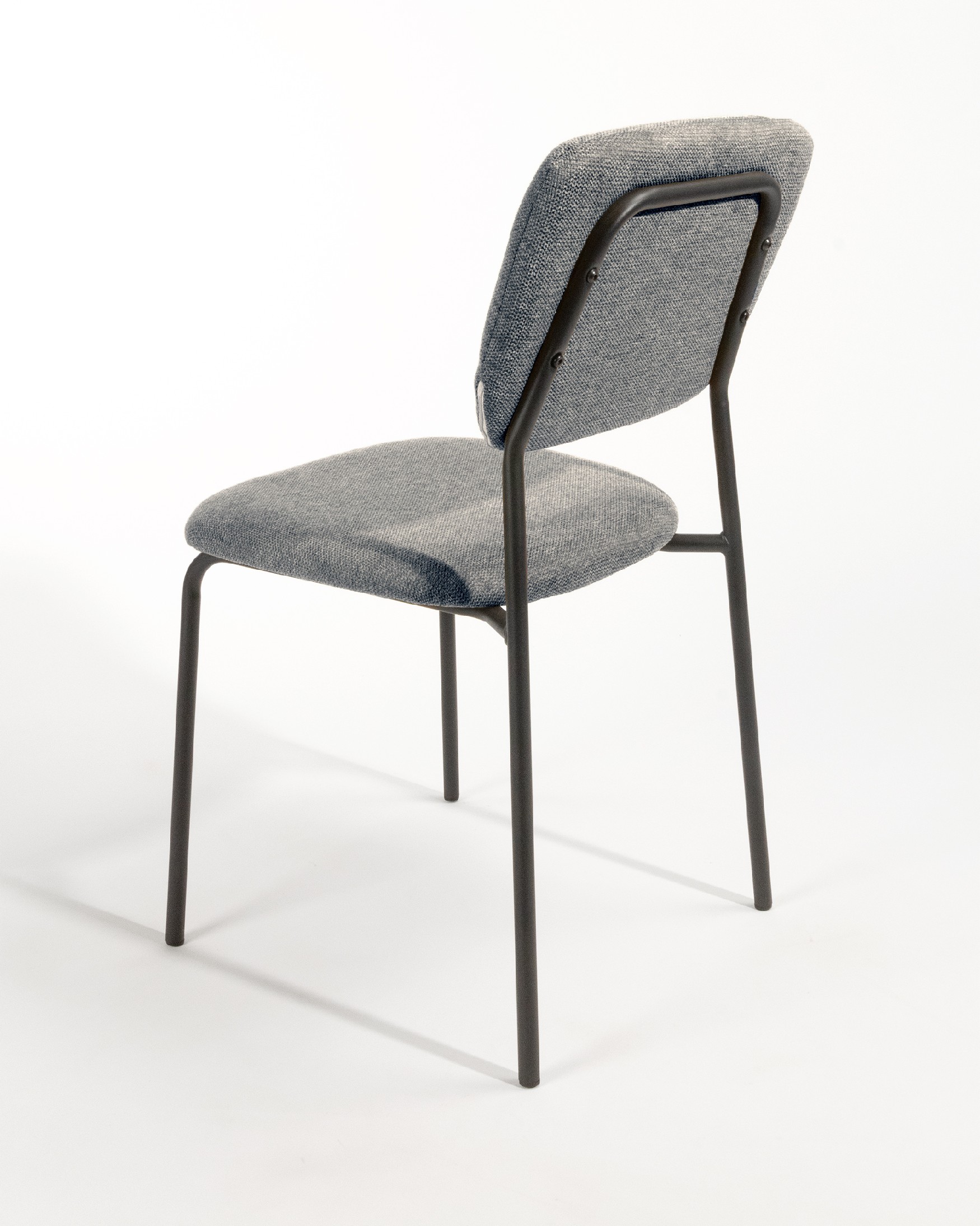 Kobe chair with gray upholstery and black metal legs