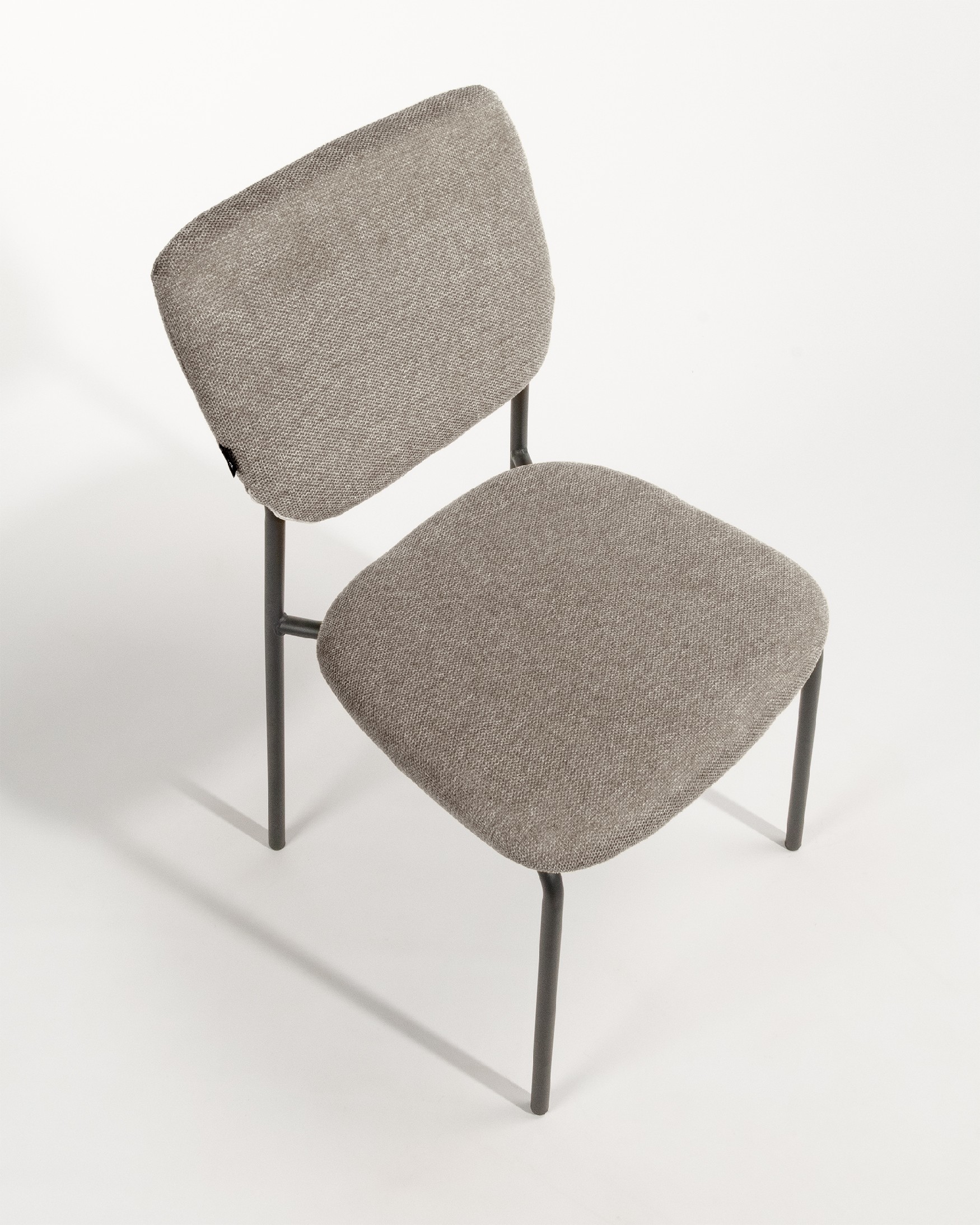 Kobe chair with brown upholstery and black metal legs