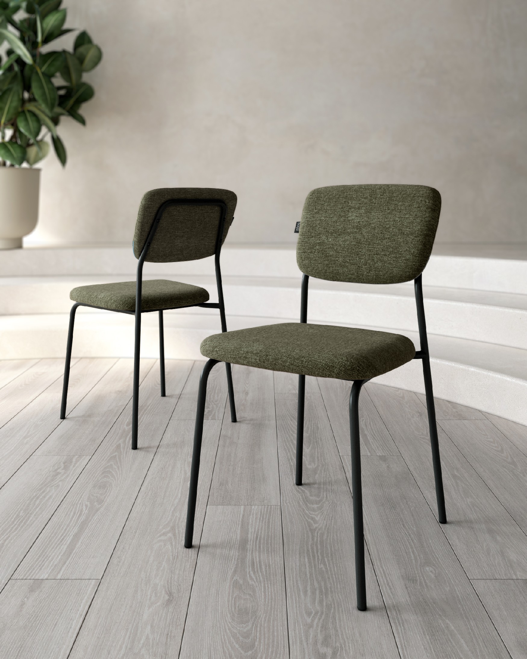Silla Kobe con tapizado verde y patas metálicas negras
