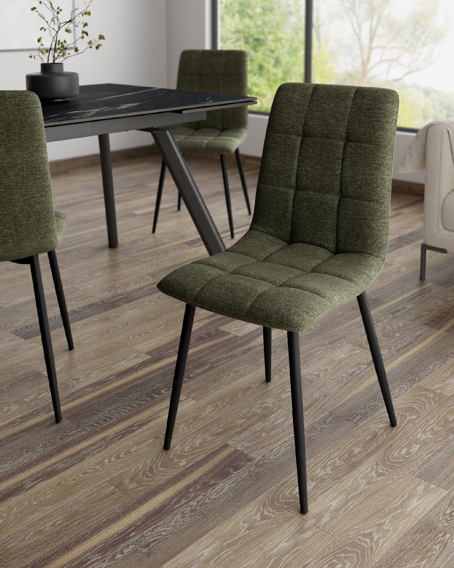 Lisbon chair with green upholstery and black metal legs