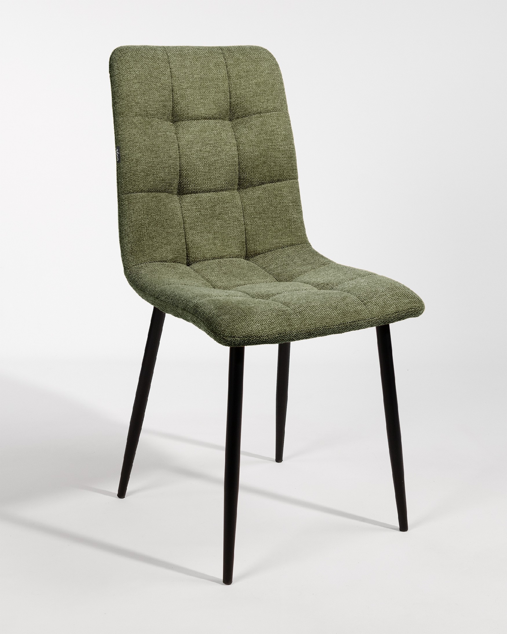 Lisbon chair with green upholstery and black metal legs