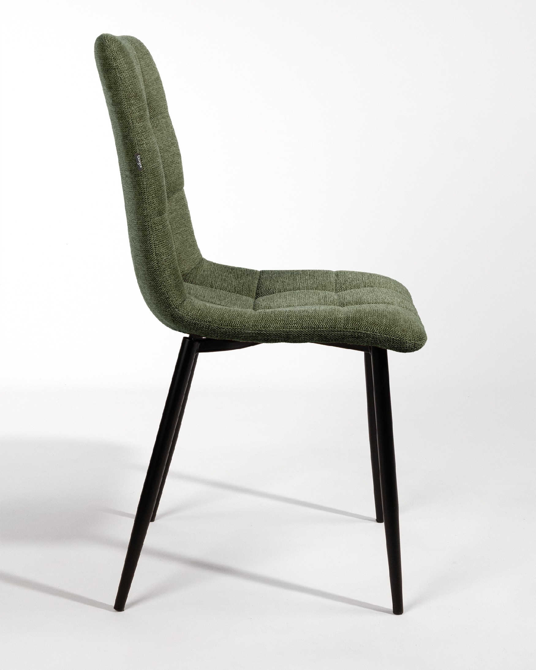 Lisbon chair with green upholstery and black metal legs