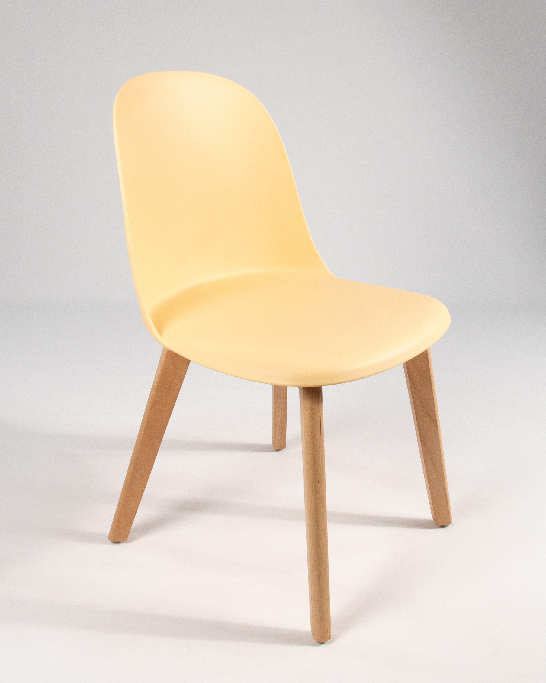 Miami chair with wooden legs and yellow upholstery