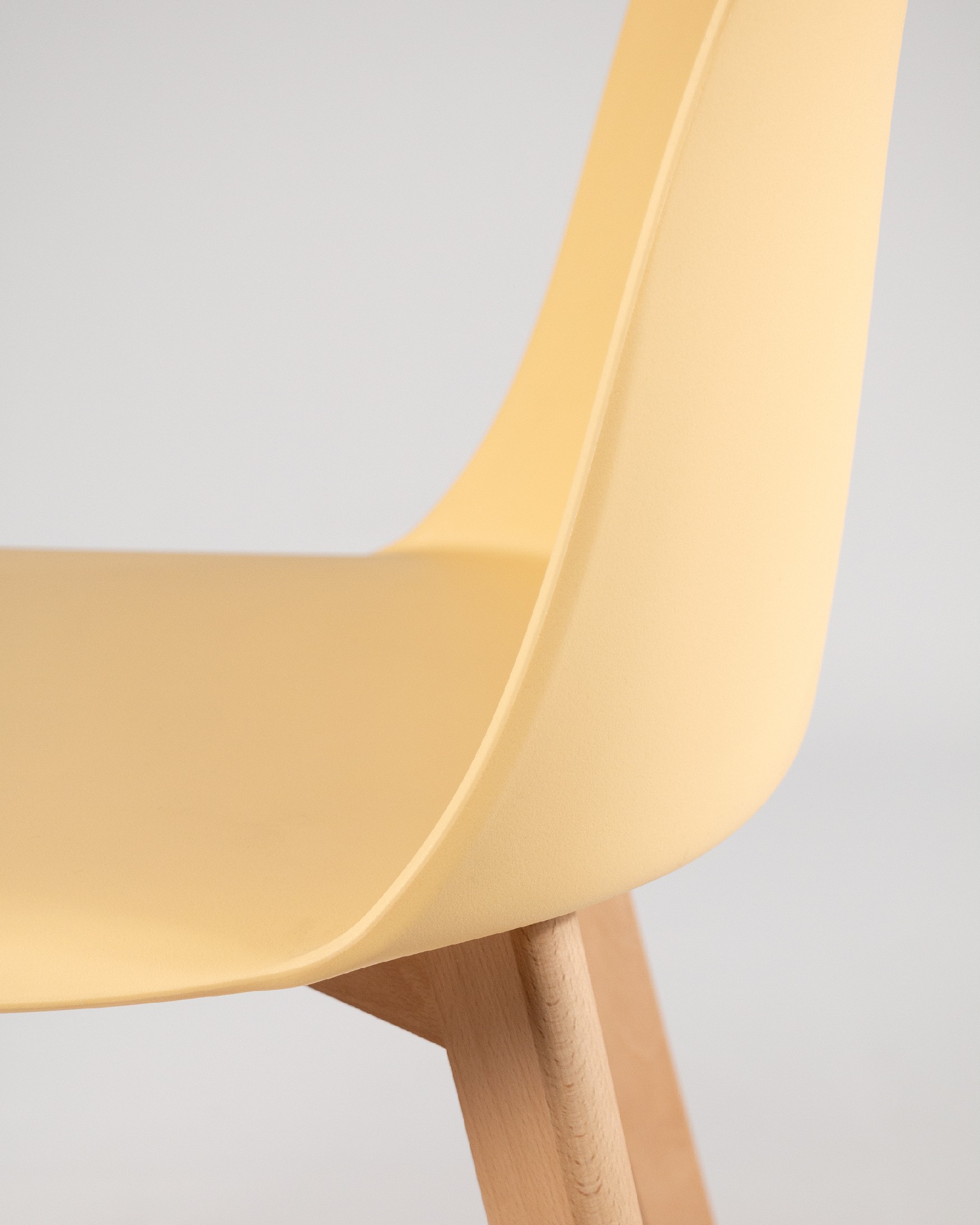 Miami chair with wooden legs and yellow upholstery