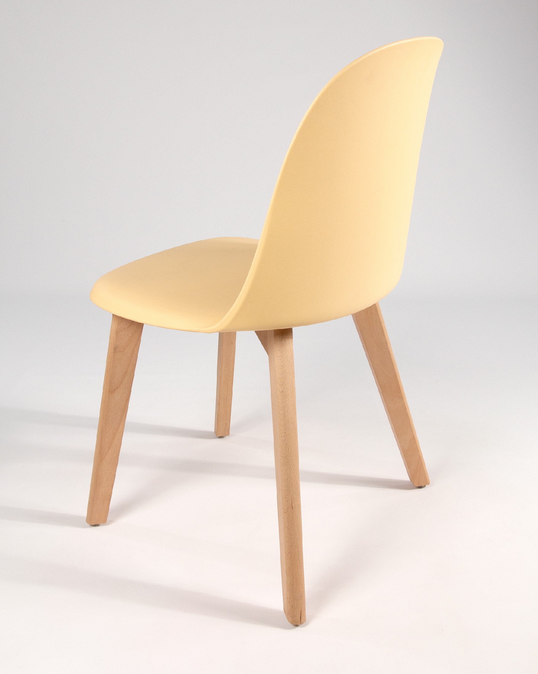 Miami chair with wooden legs and yellow upholstery