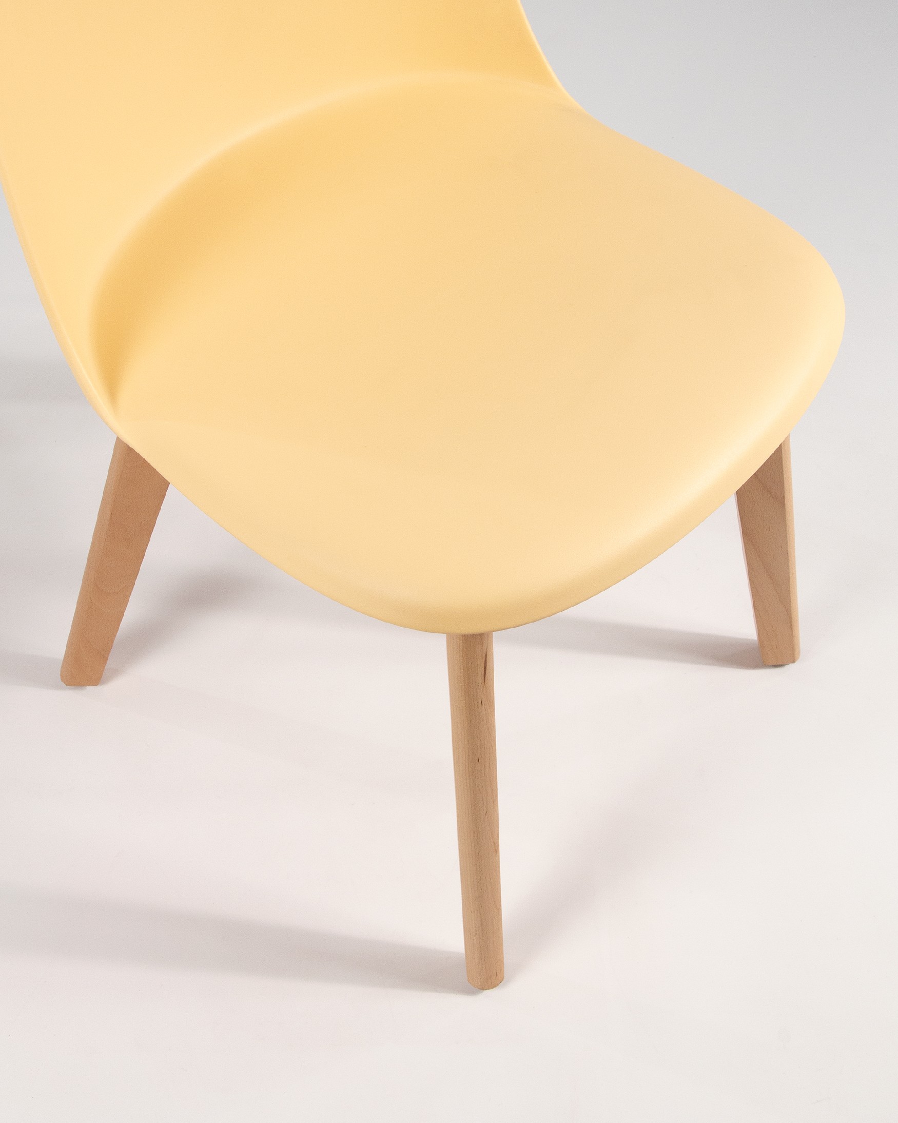 Miami chair with wooden legs and yellow upholstery