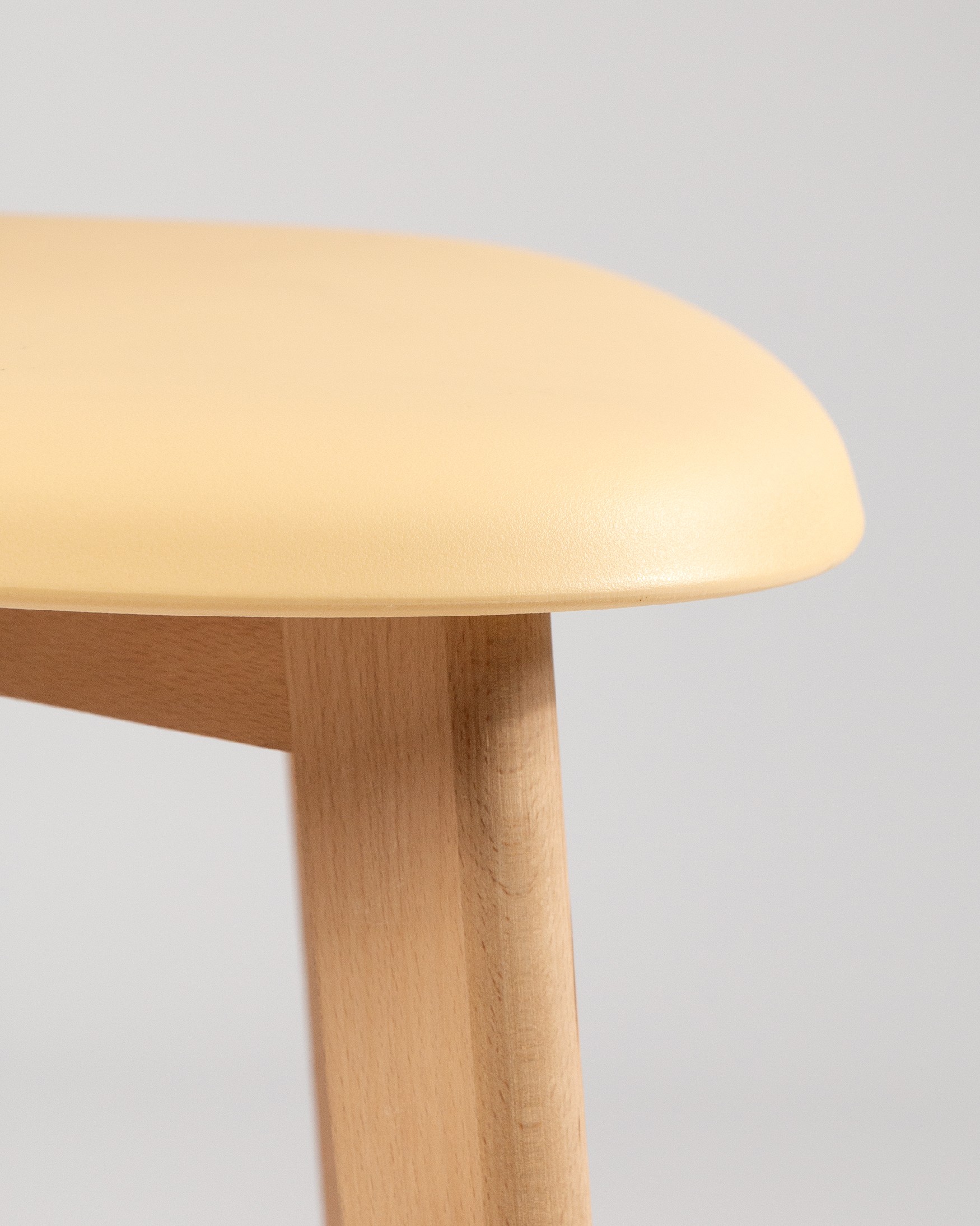 Miami chair with wooden legs and yellow upholstery