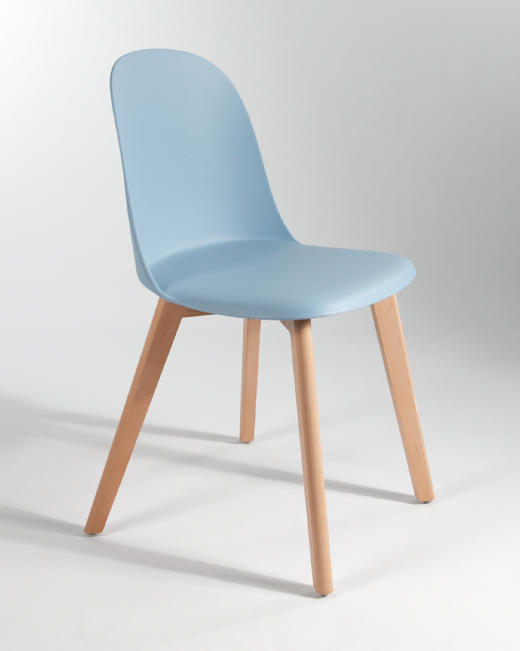 Miami chair with wooden legs and sky upholstery