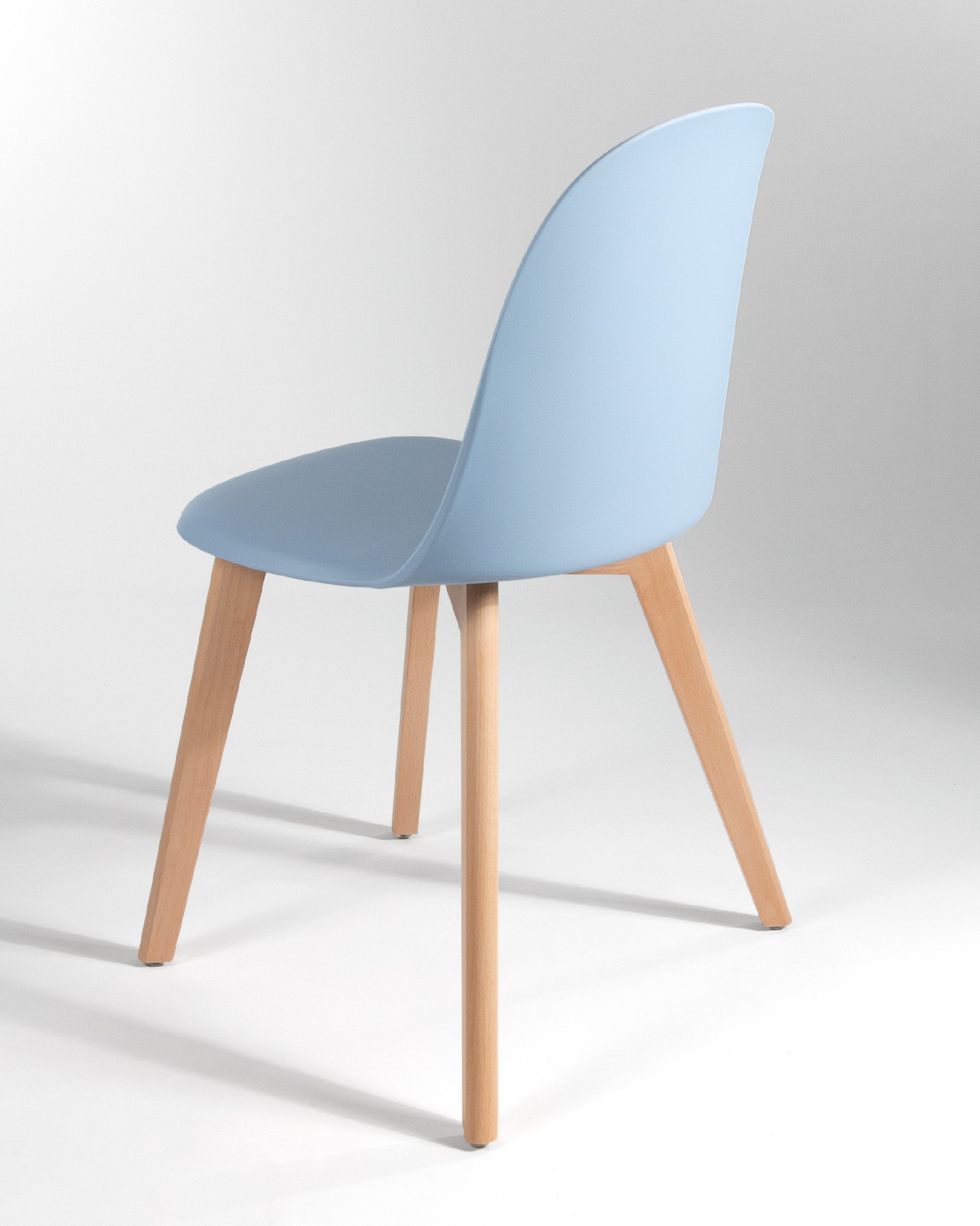 Miami chair with wooden legs and sky upholstery