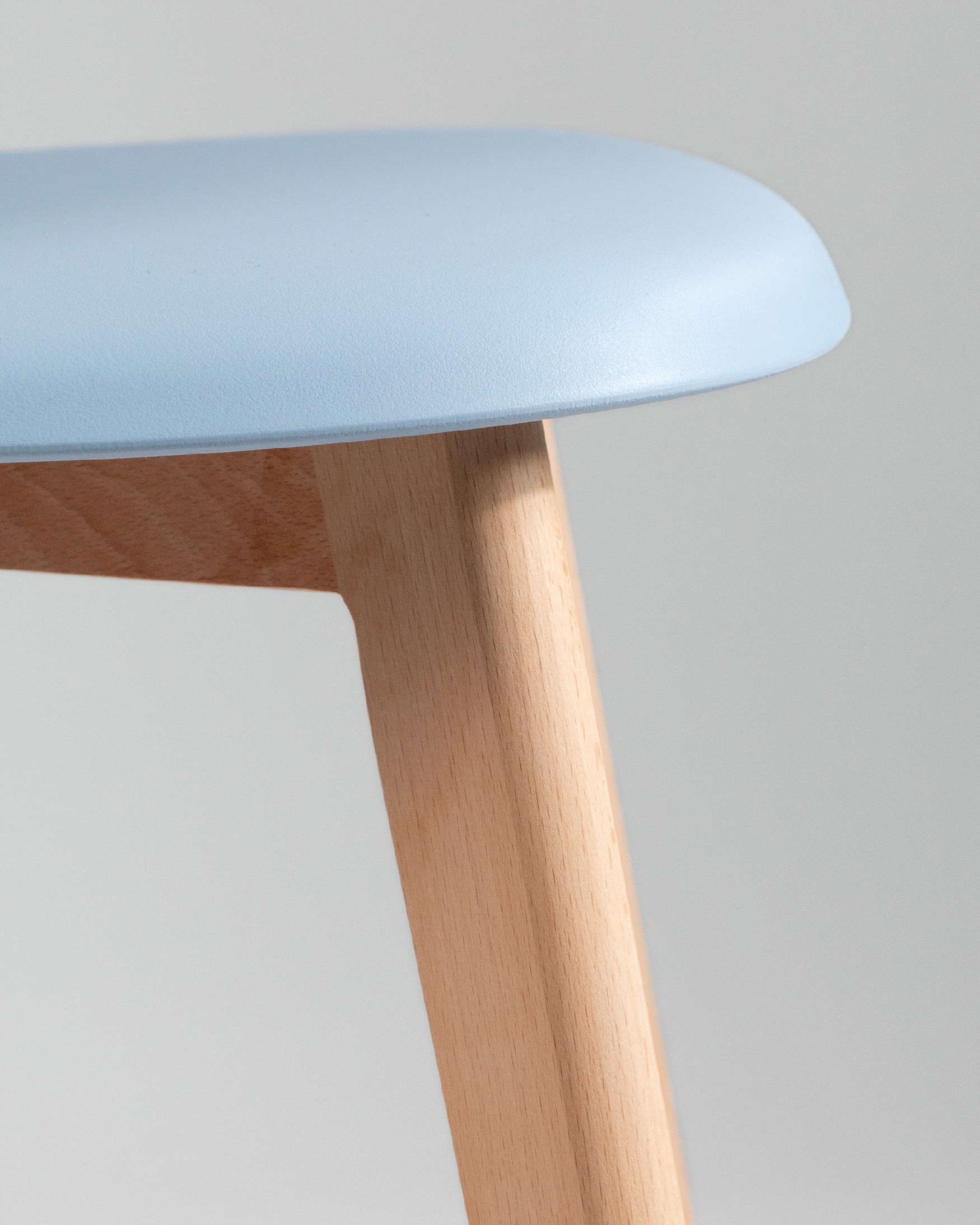 Miami chair with wooden legs and sky upholstery