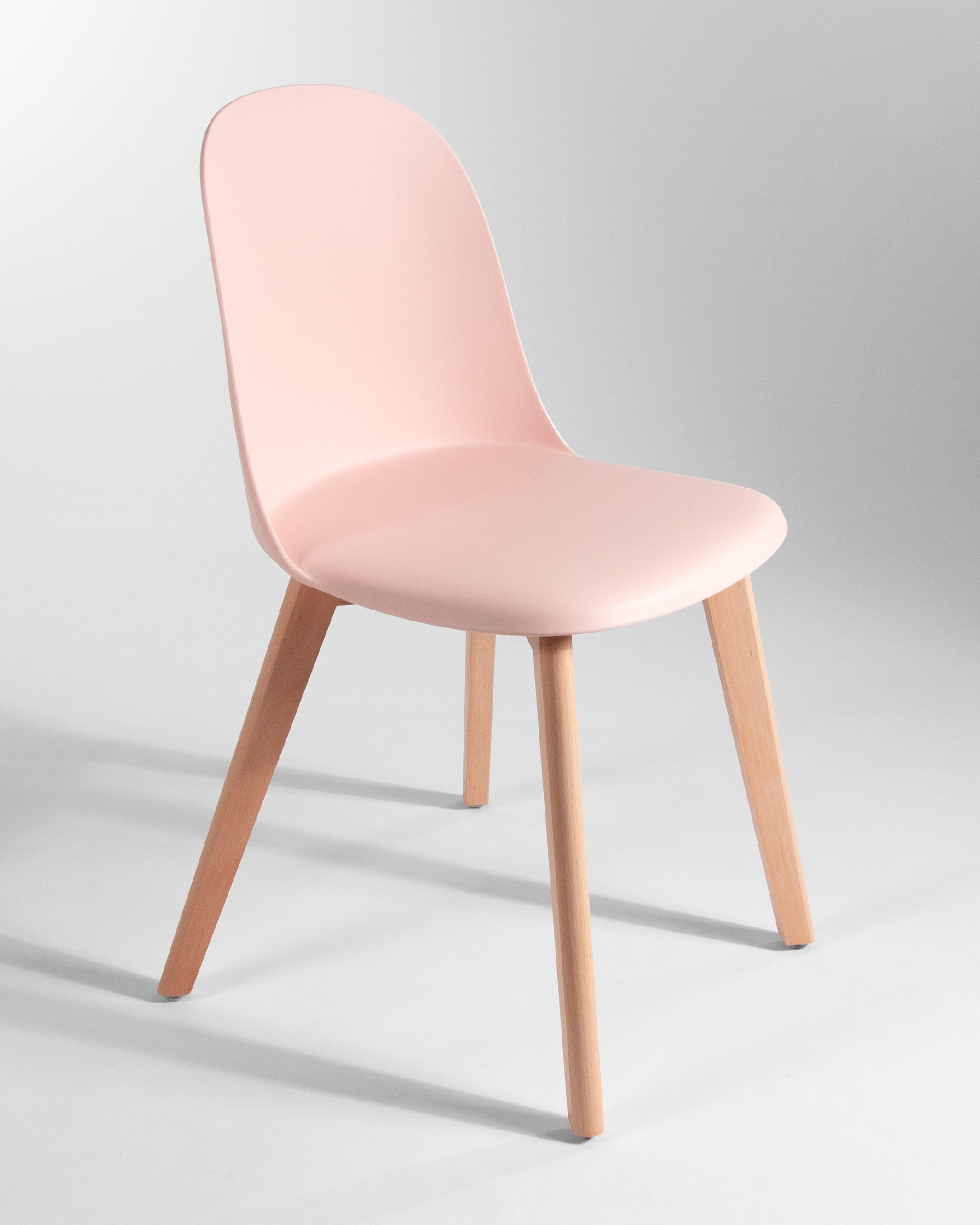 Miami chair with wooden legs and pink upholstery