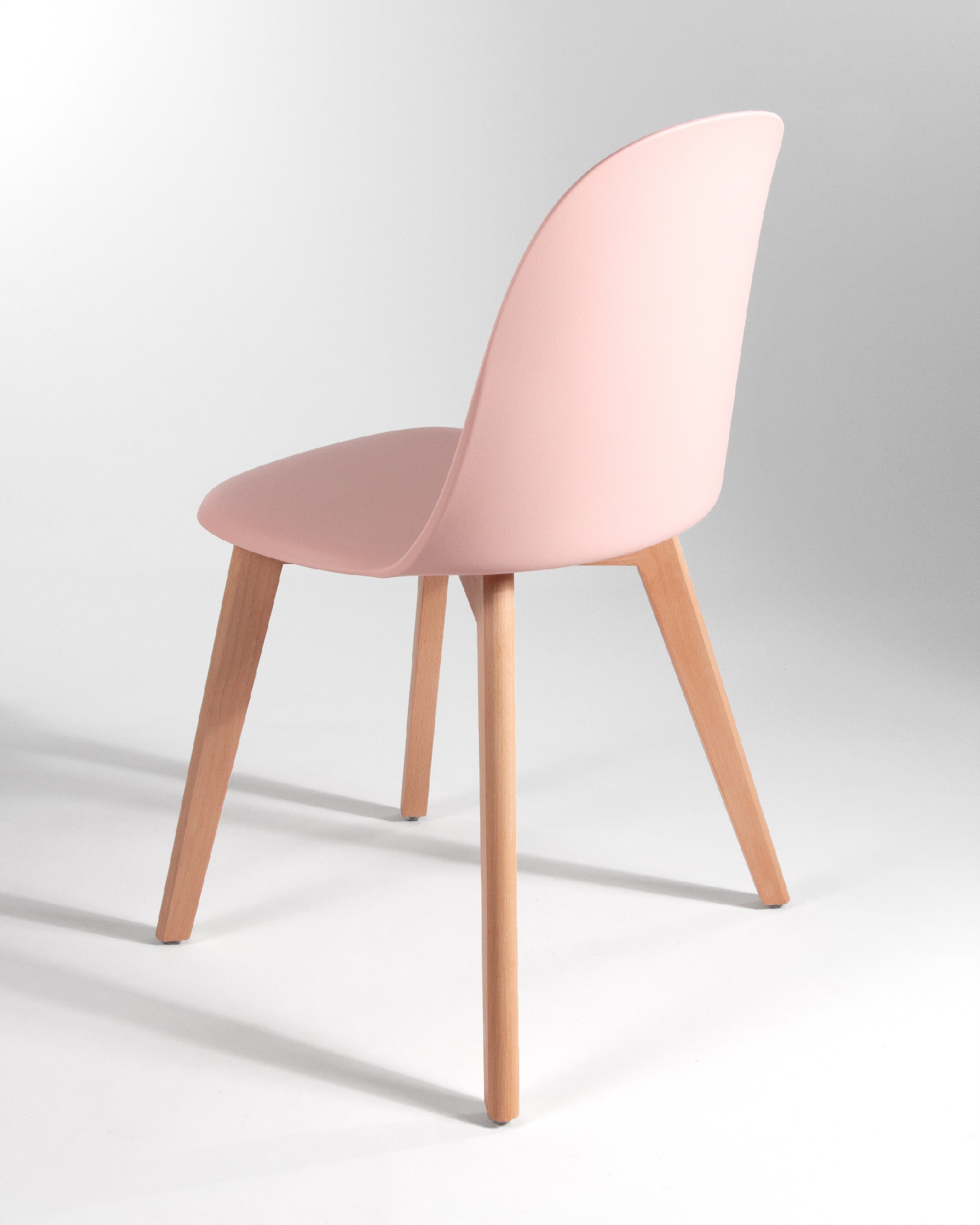 Miami chair with wooden legs and pink upholstery