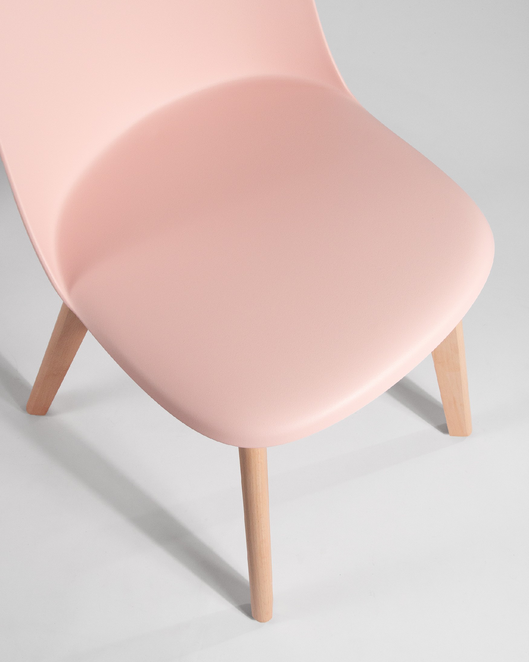 Miami chair with wooden legs and pink upholstery