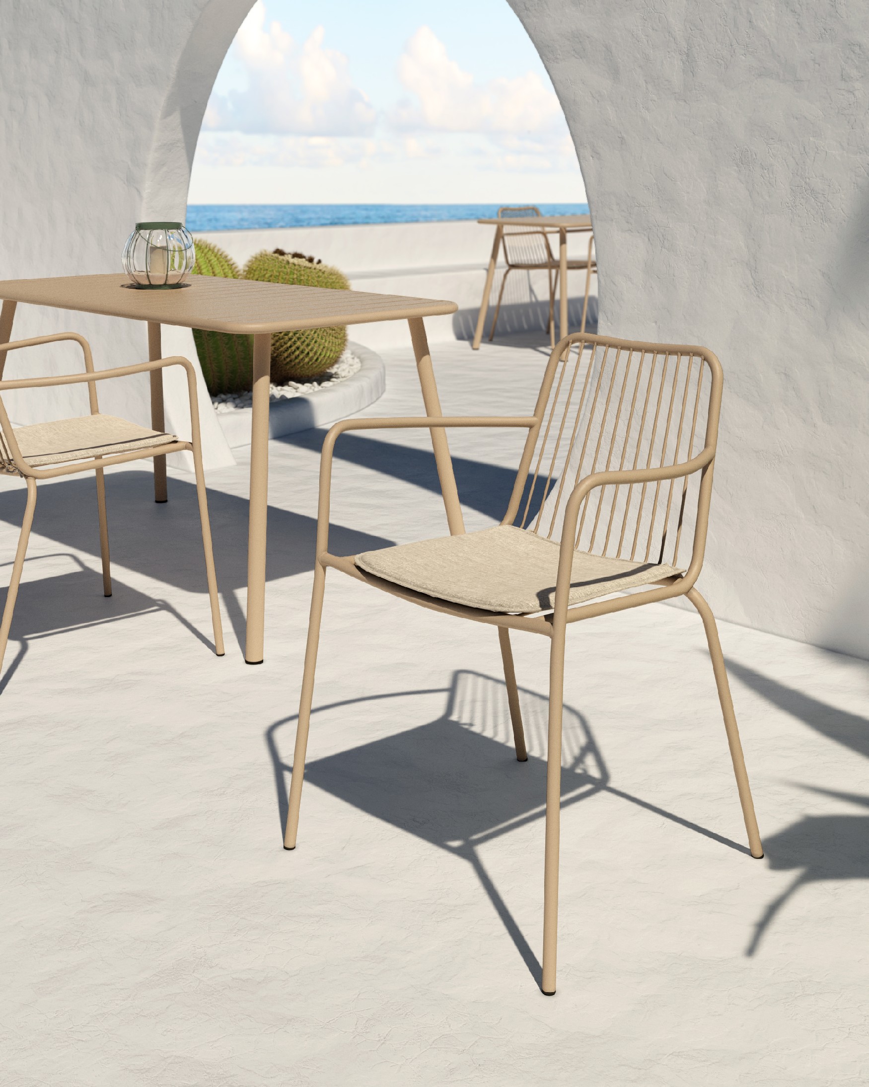 Ohana metal chair in sand with cushion