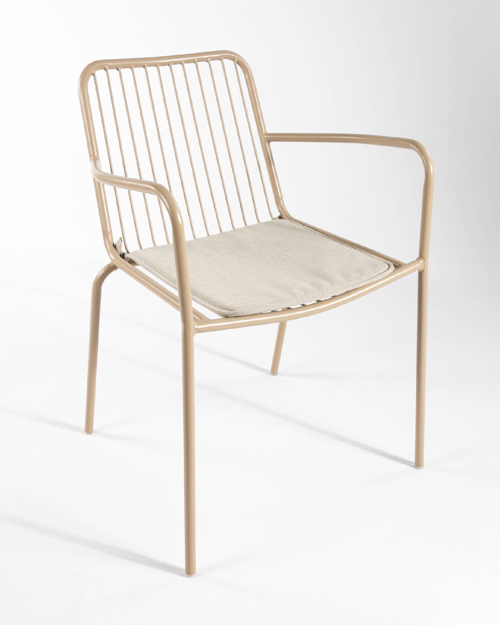 Ohana metal chair in sand with cushion