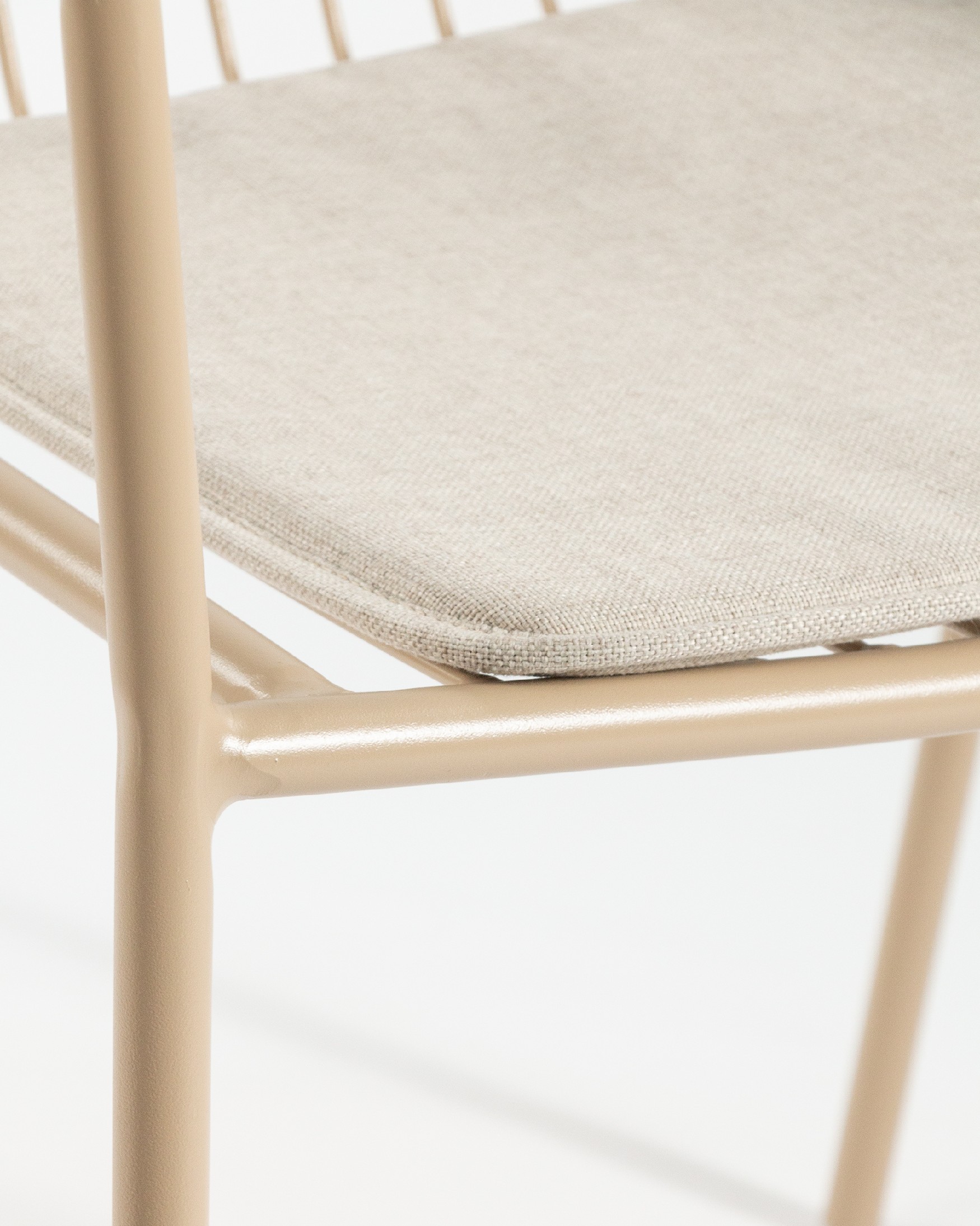 Ohana metal chair in sand with cushion