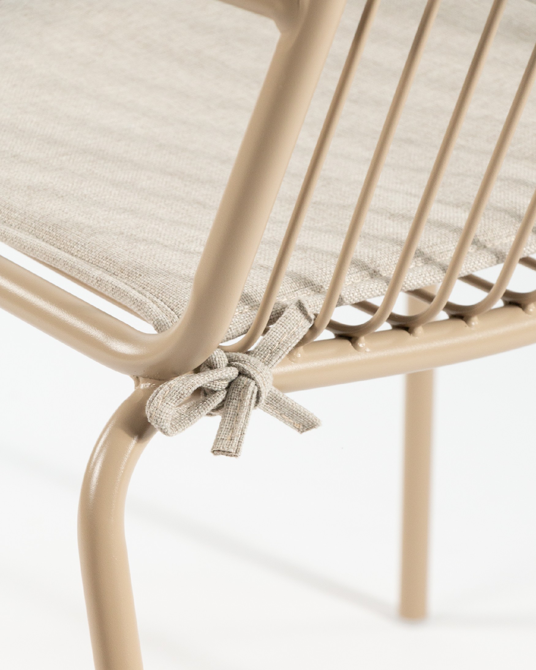 Ohana metal chair in sand with cushion
