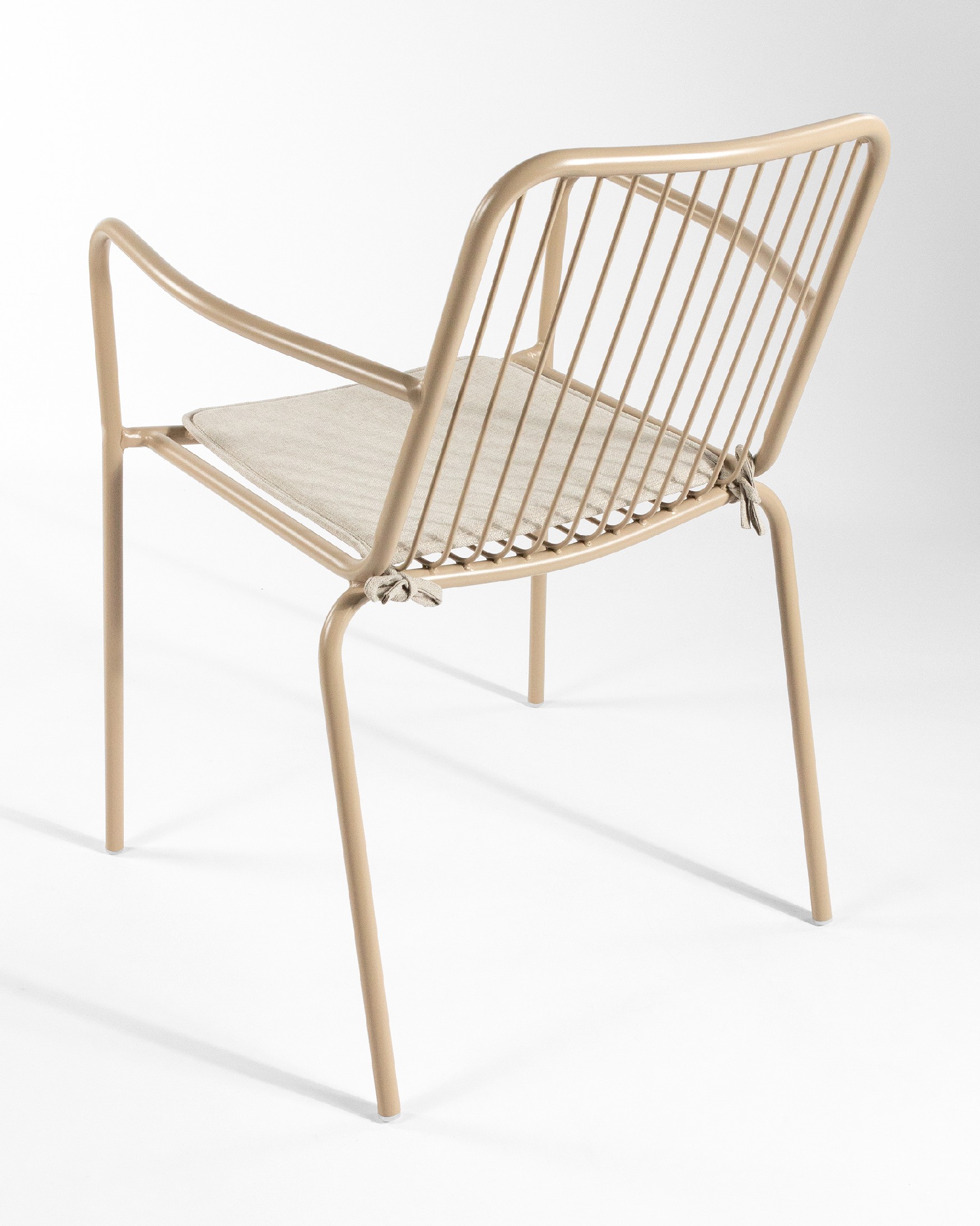 Ohana metal chair in sand with cushion
