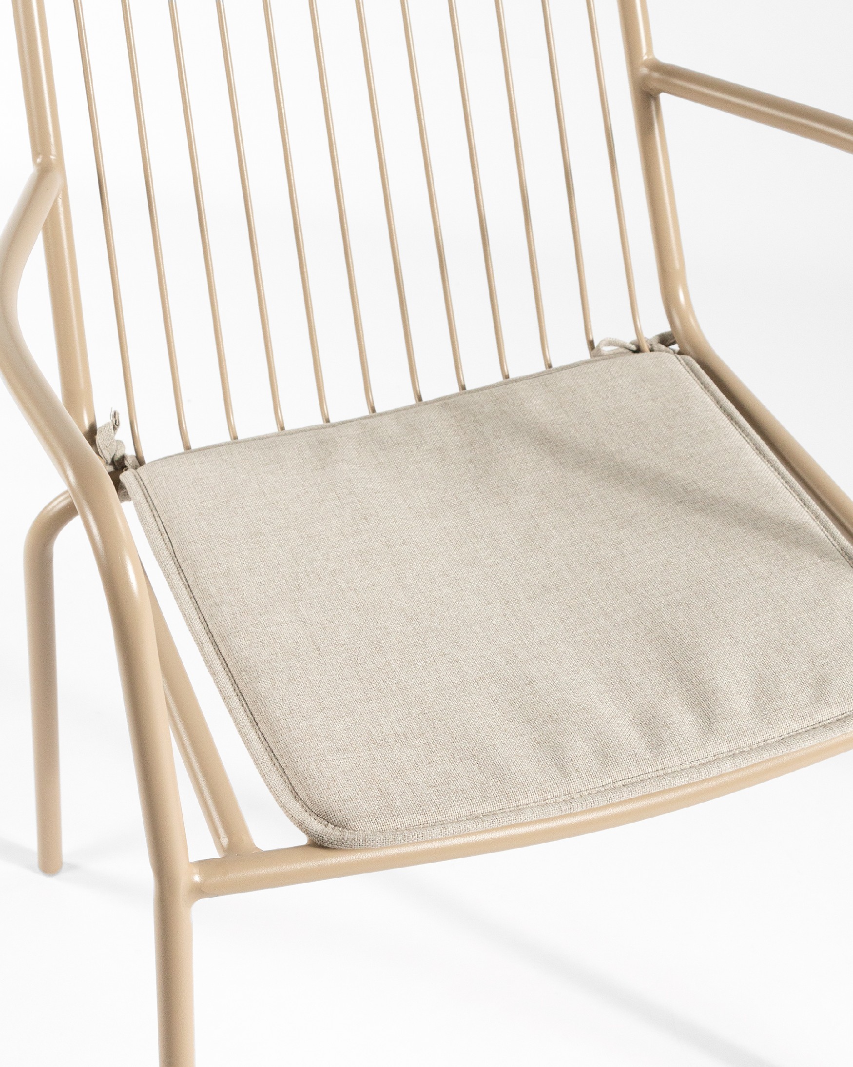 Ohana metal chair in sand with cushion