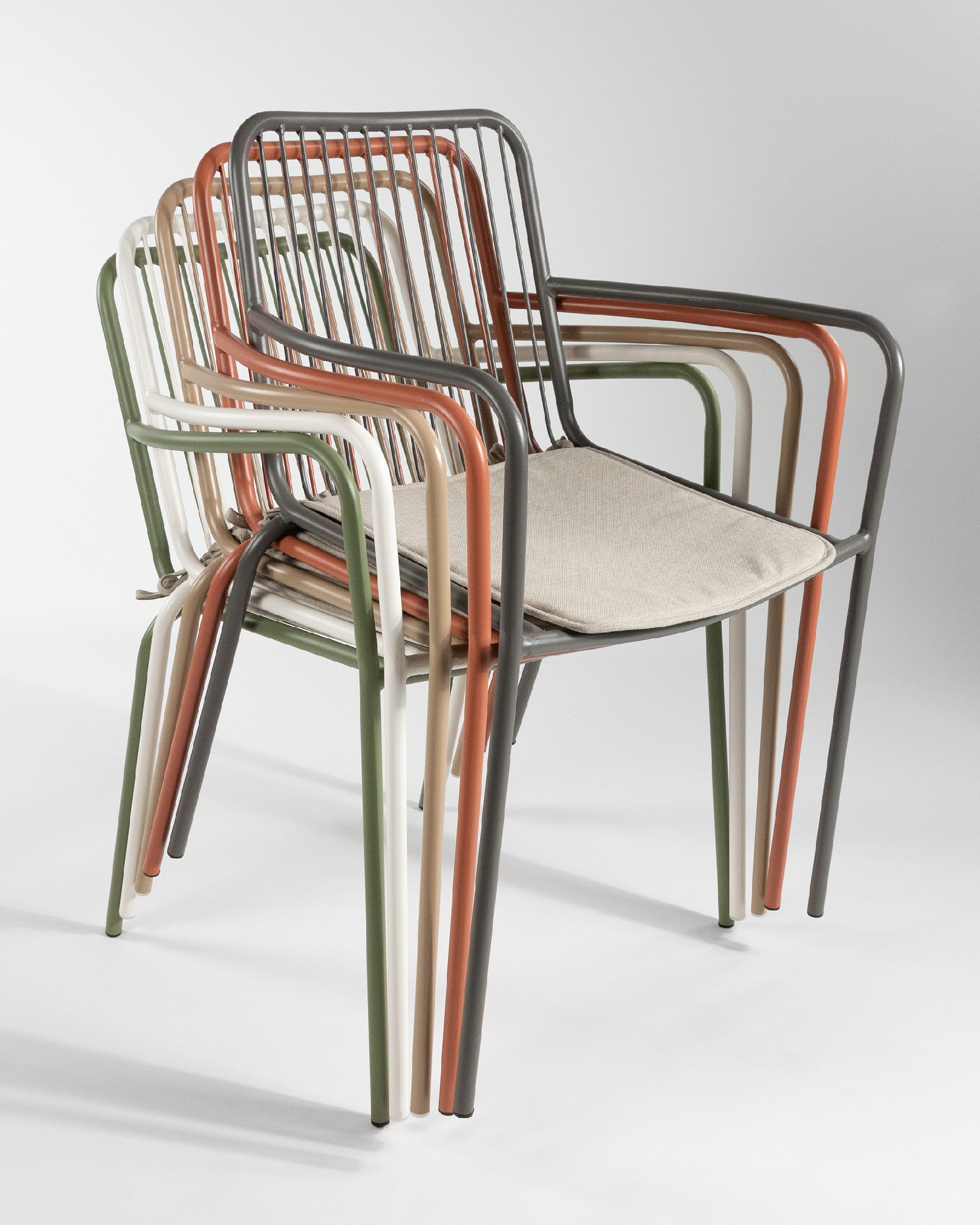 Ohana metal chair in sand with cushion