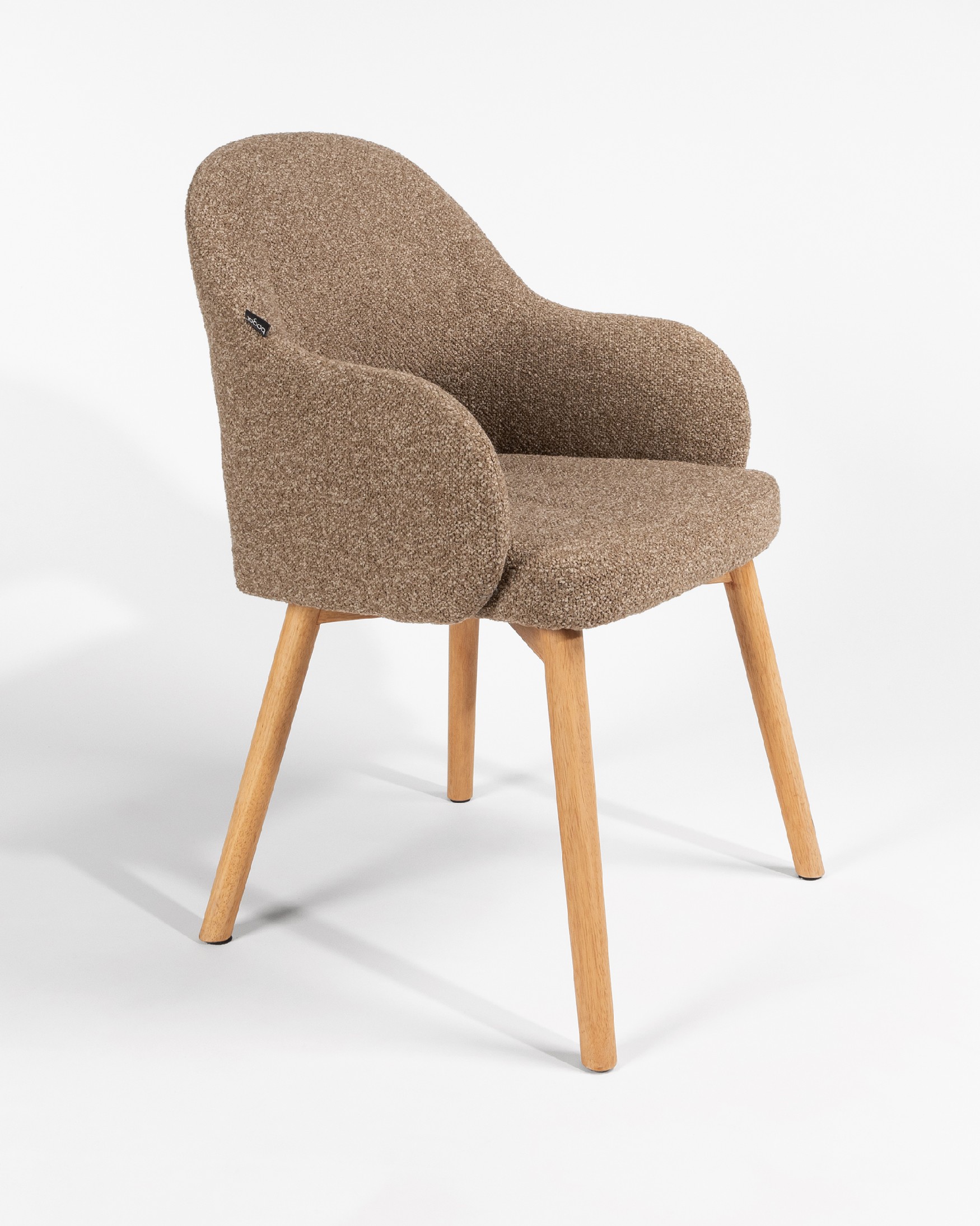 Ona chair with brown upholstery and oak legs