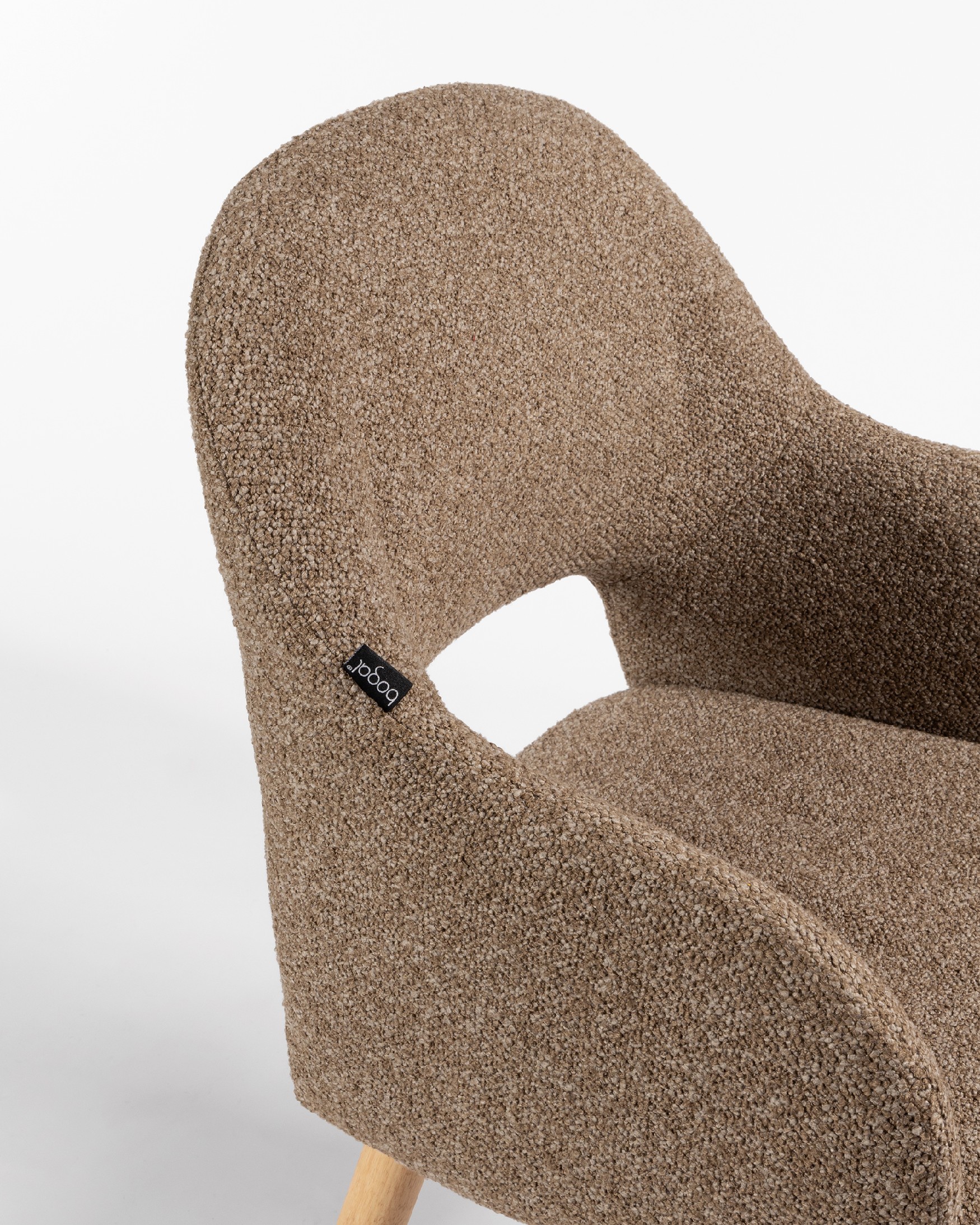 Ona chair with brown upholstery and oak legs