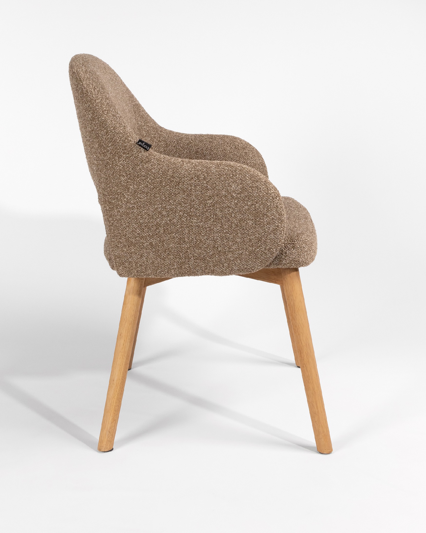 Ona chair with brown upholstery and oak legs