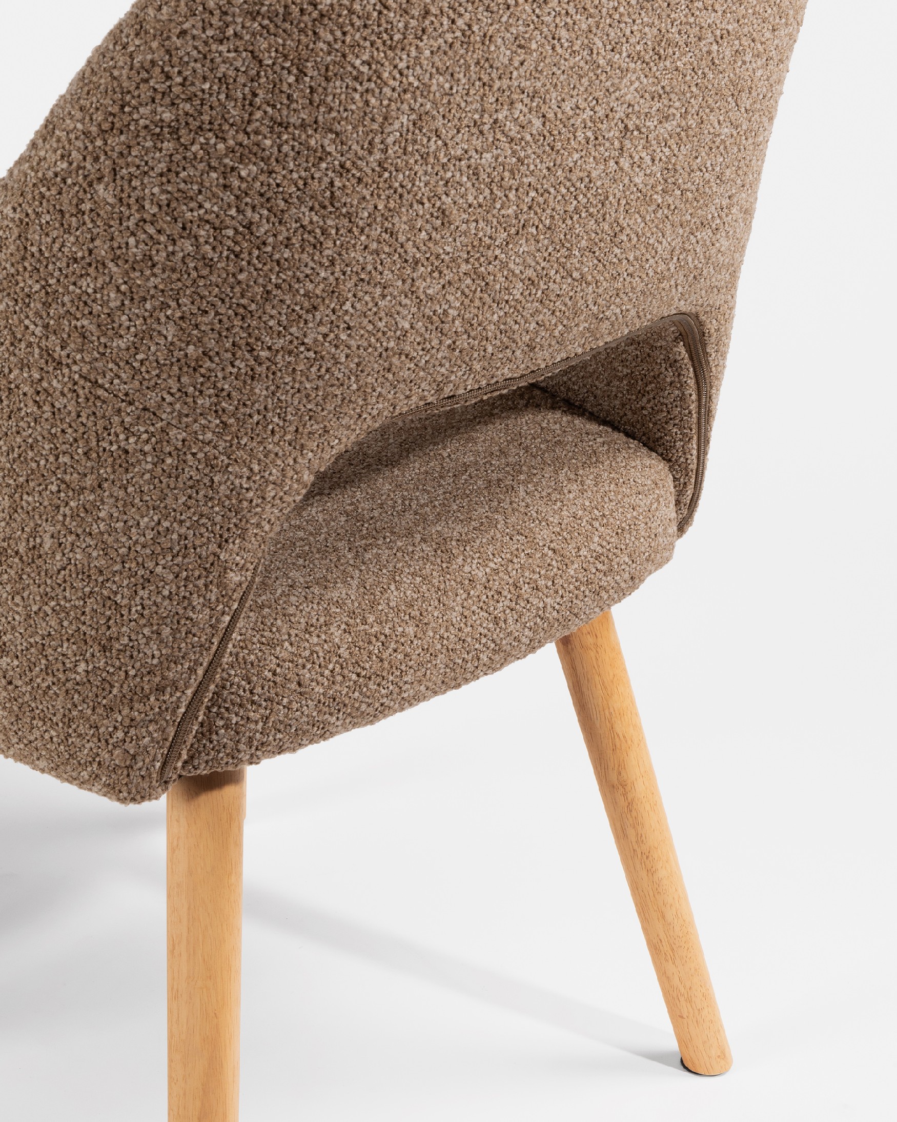 Ona chair with brown upholstery and oak legs