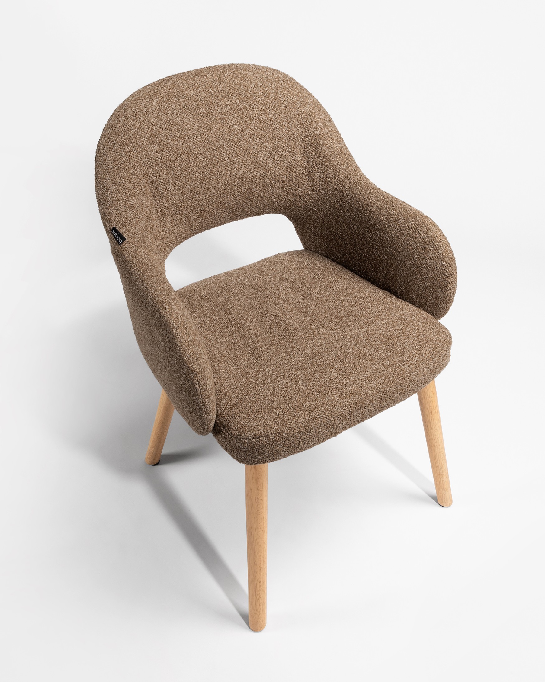 Ona chair with brown upholstery and oak legs
