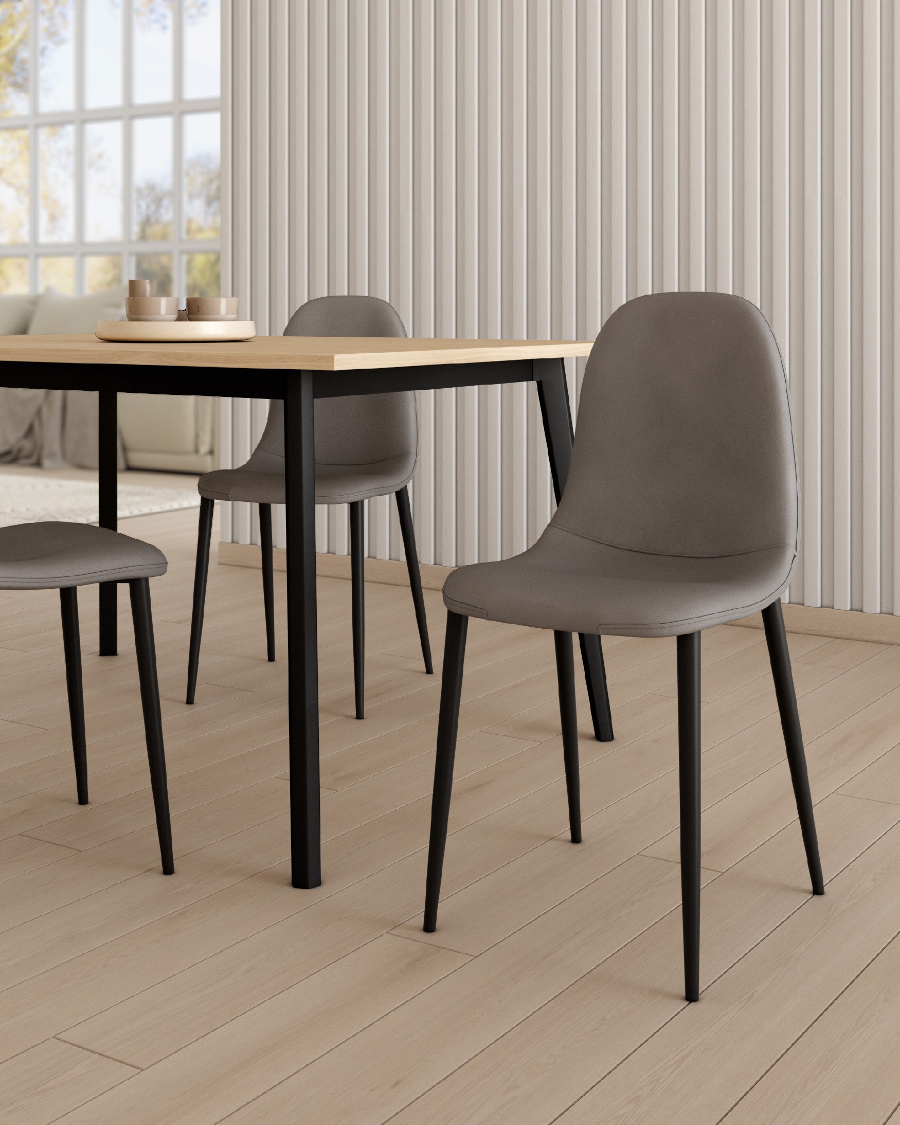 Oporto chair with gray upholstery and black metal legs