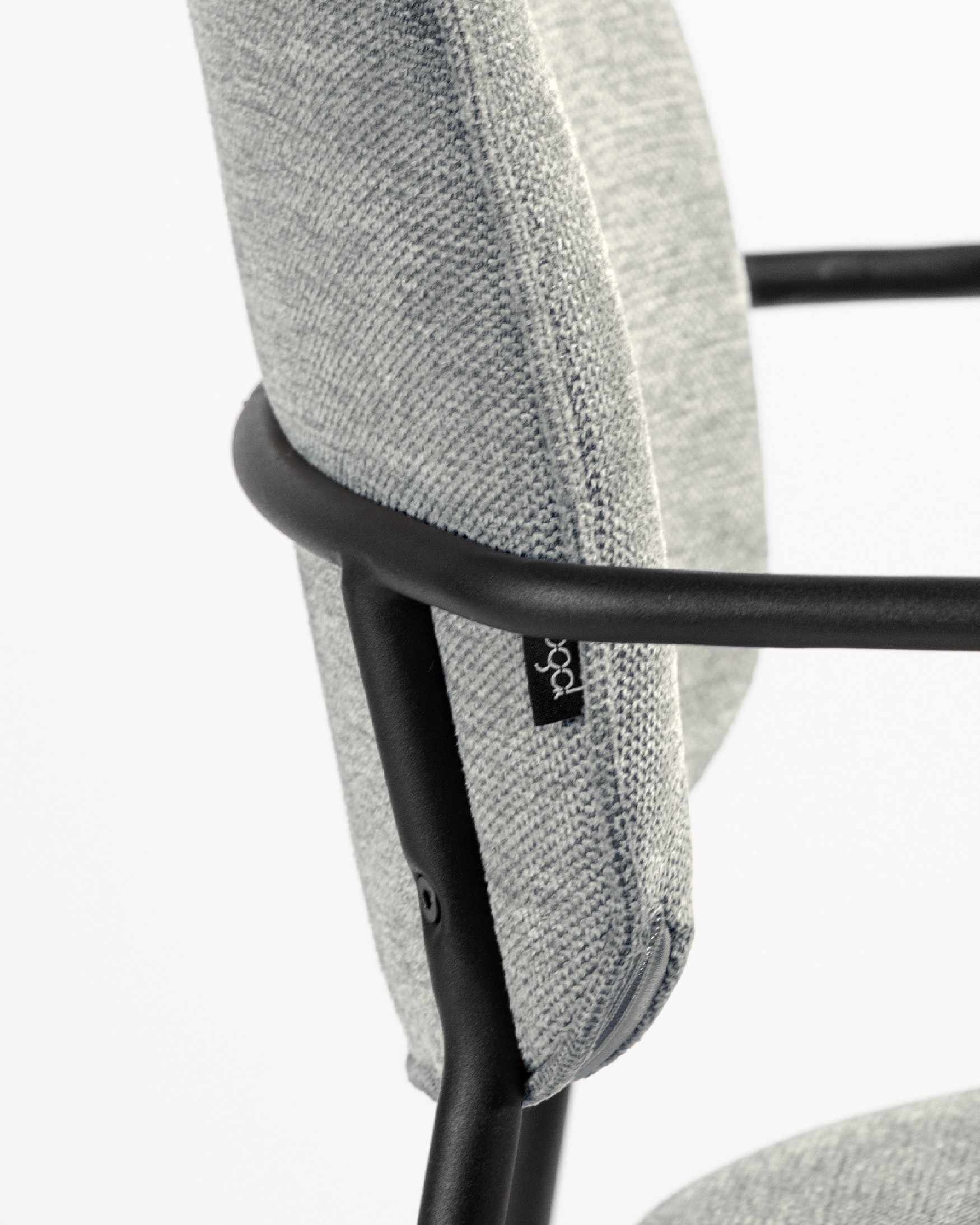 Osaka chair with gray upholstery and black metal legs