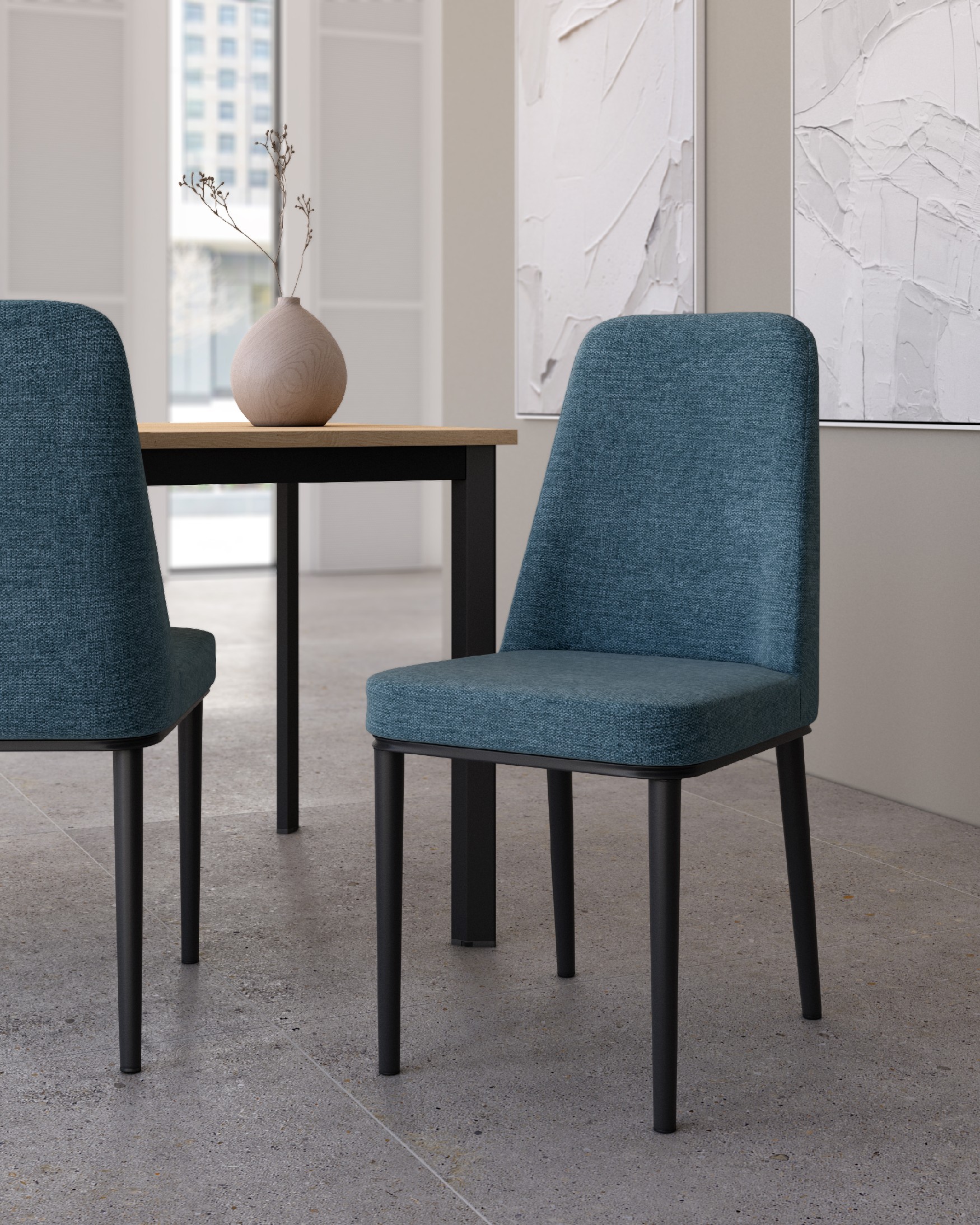Oslo chair with blue upholstery and black legs