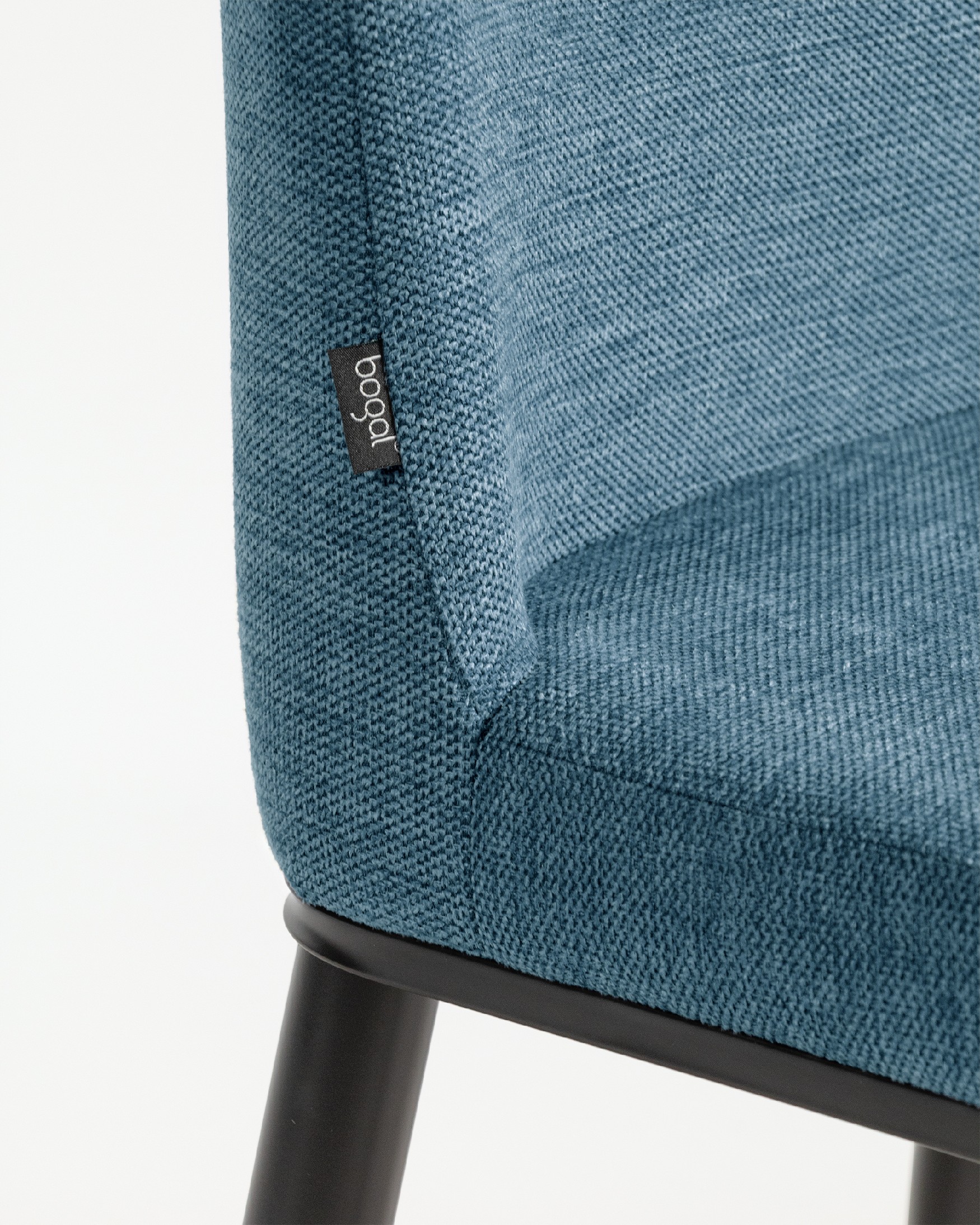 Oslo chair with blue upholstery and black legs