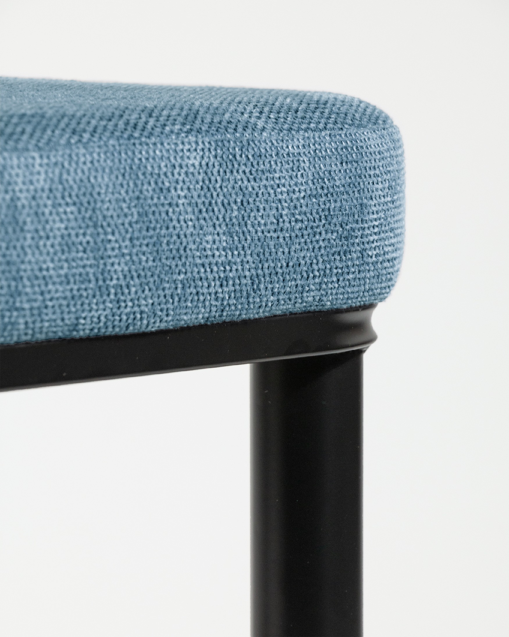 Oslo chair with blue upholstery and black legs