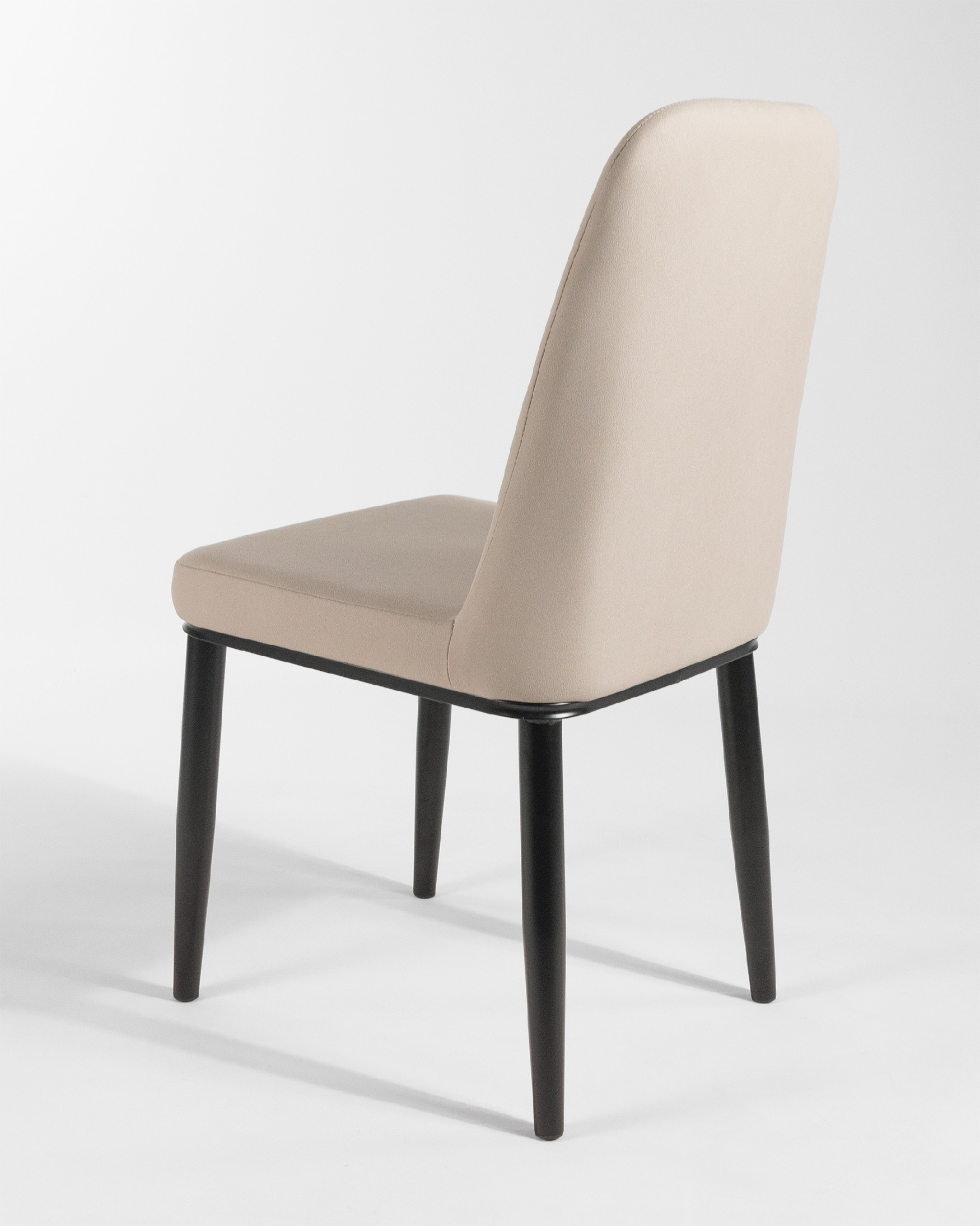 Oslo chair with beige upholstery and black legs