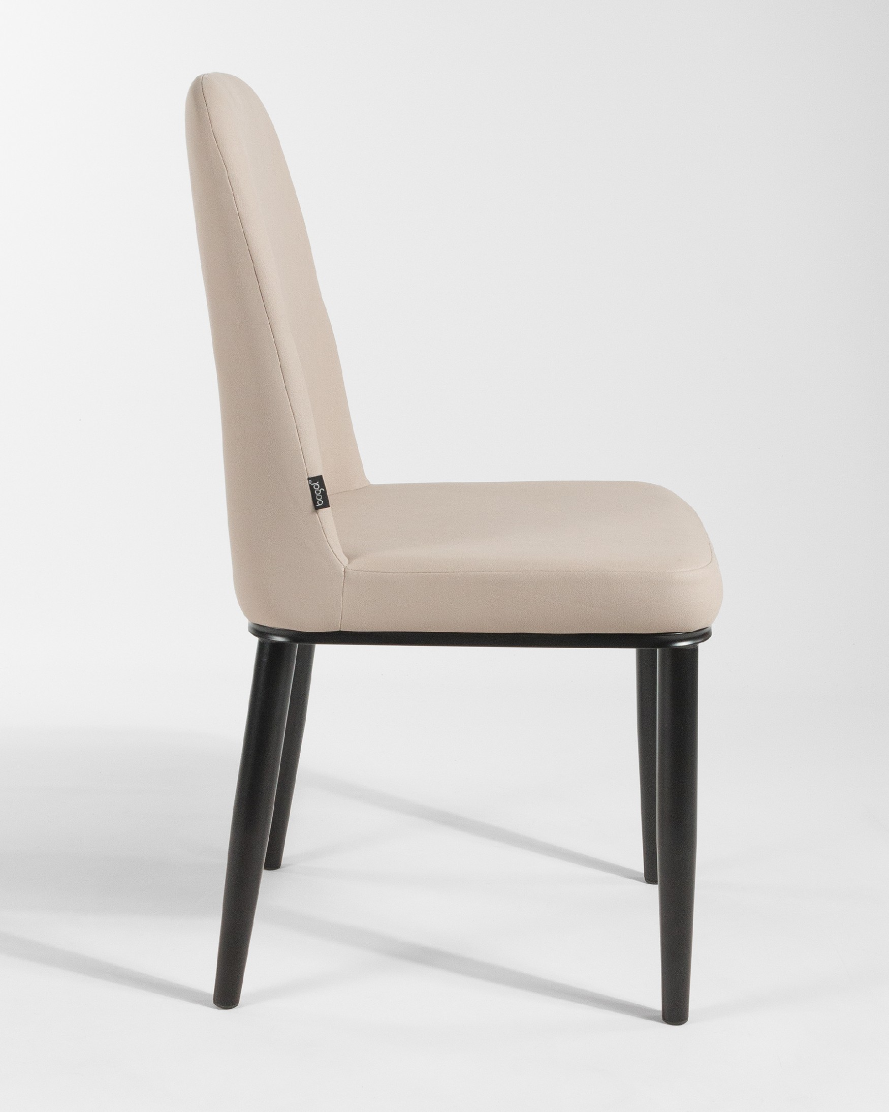 Oslo chair with beige upholstery and black legs
