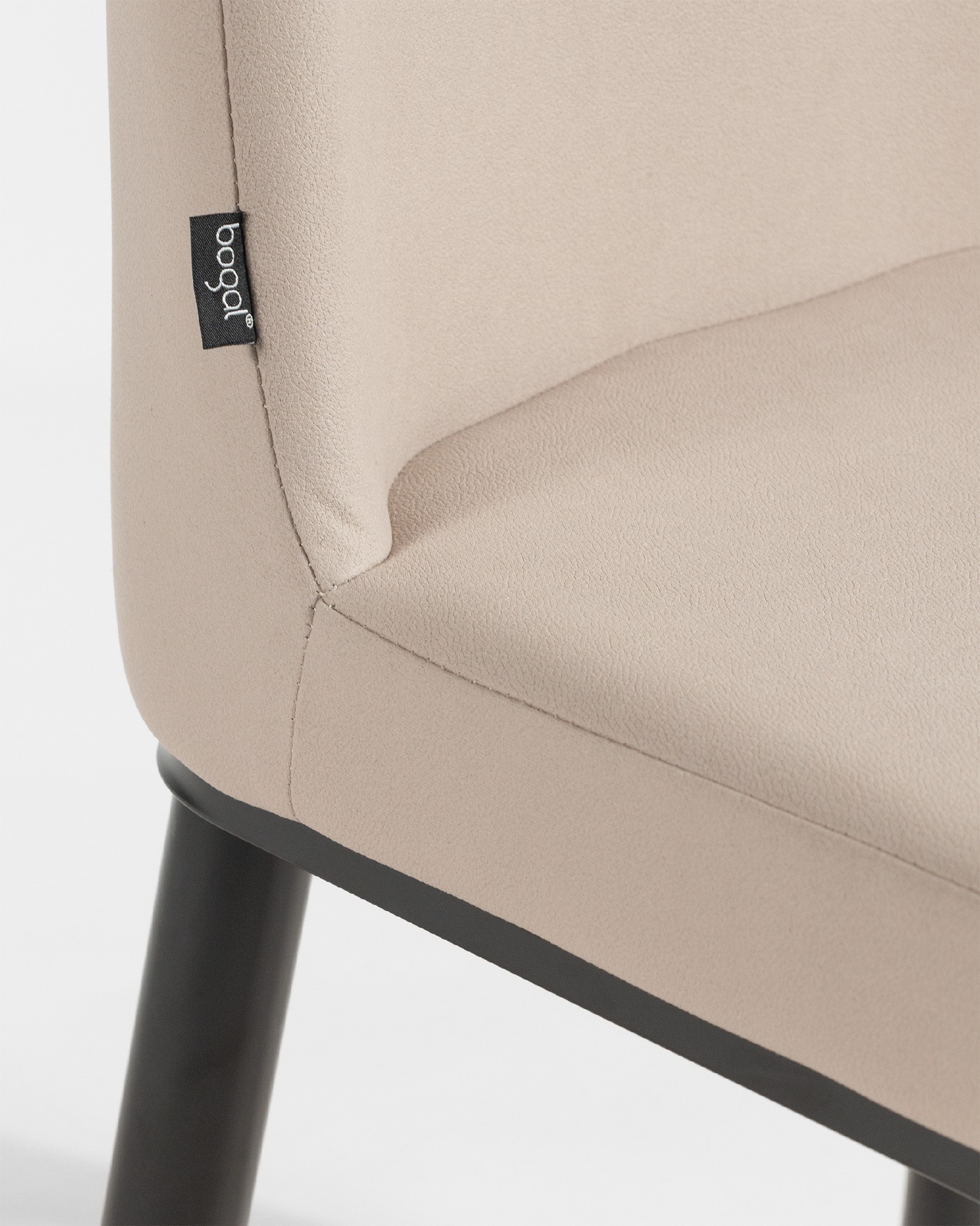 Oslo chair with beige upholstery and black legs