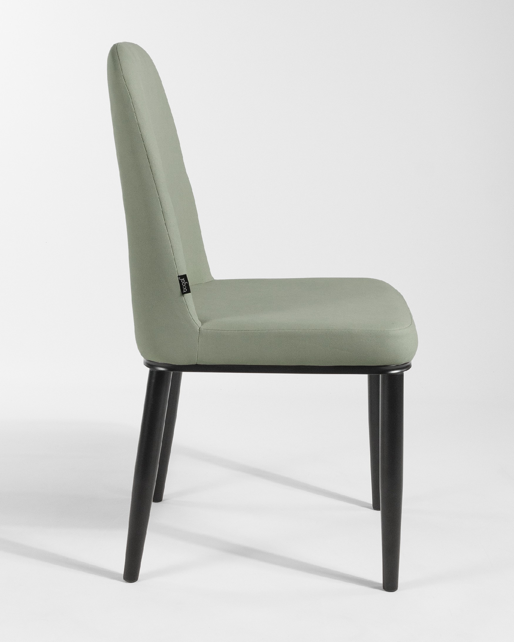 Oslo chair with moss upholstery and black legs